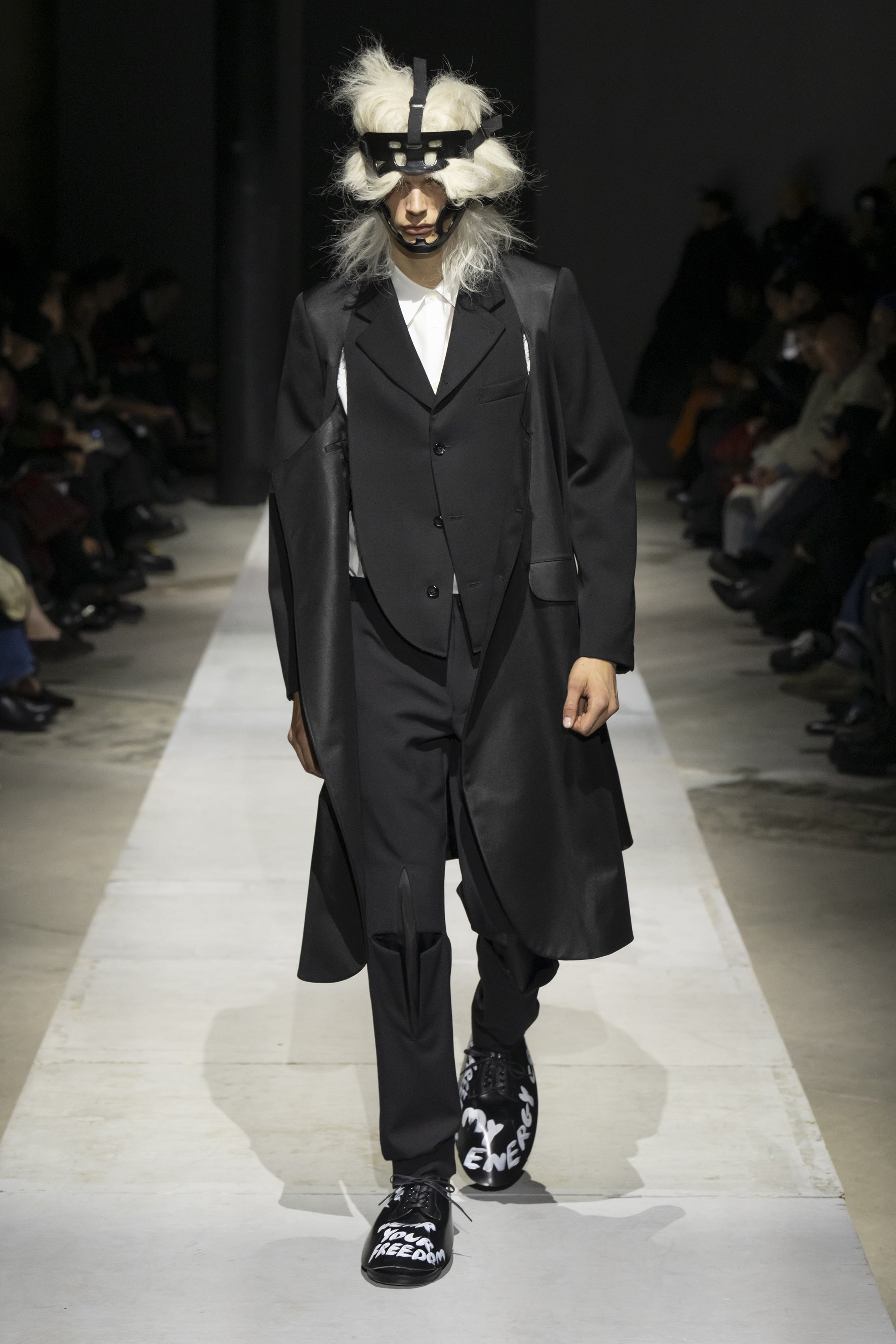 Fashion model wearing a COMME DES GARÇONS HOMME PLUS SS26 outfit