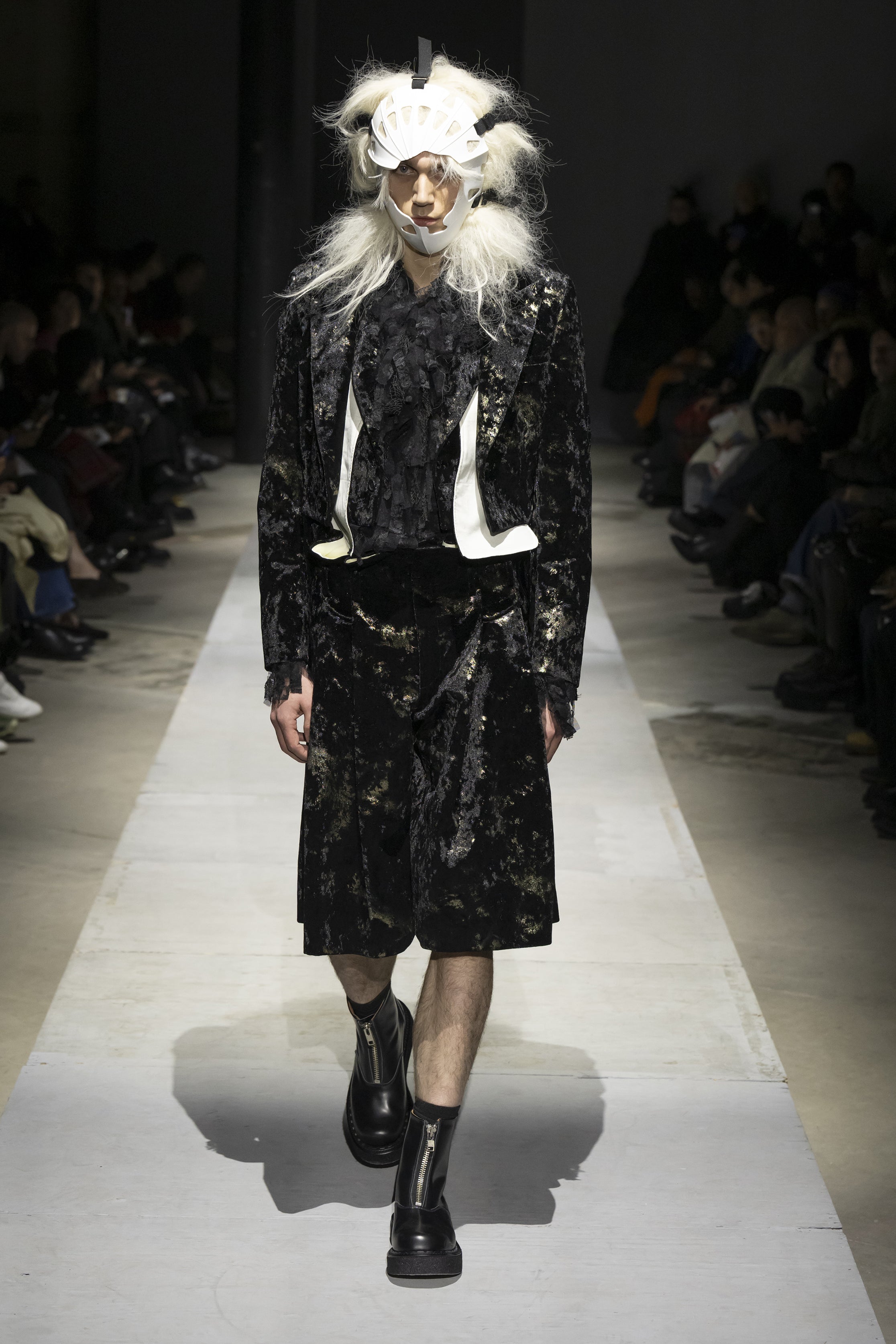 Fashion model wearing a COMME DES GARÇONS HOMME PLUS SS26 outfit