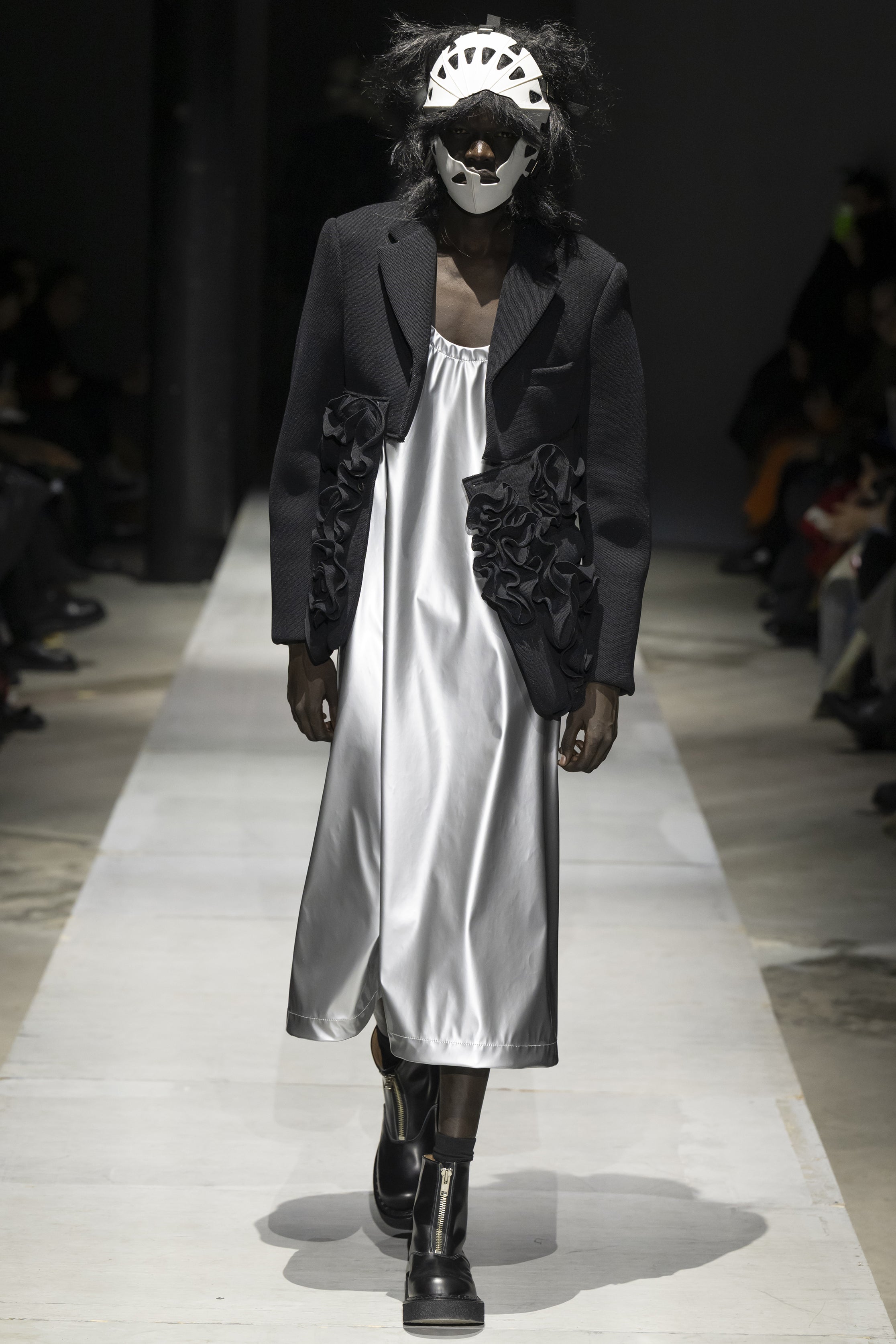 Fashion model wearing a COMME DES GARÇONS HOMME PLUS SS26 outfit
