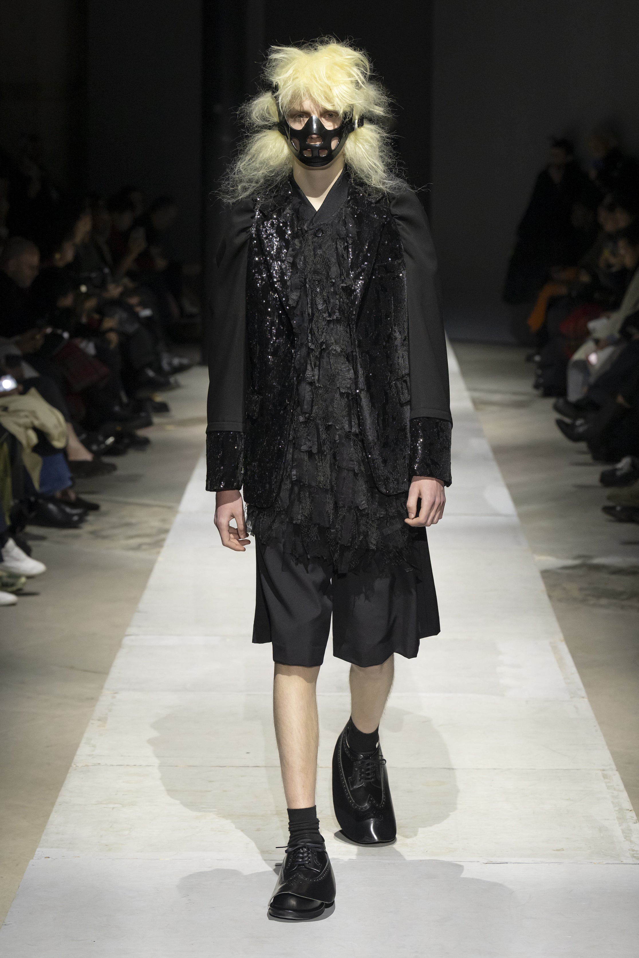 Fashion model wearing a COMME DES GARÇONS HOMME PLUS SS26 outfit