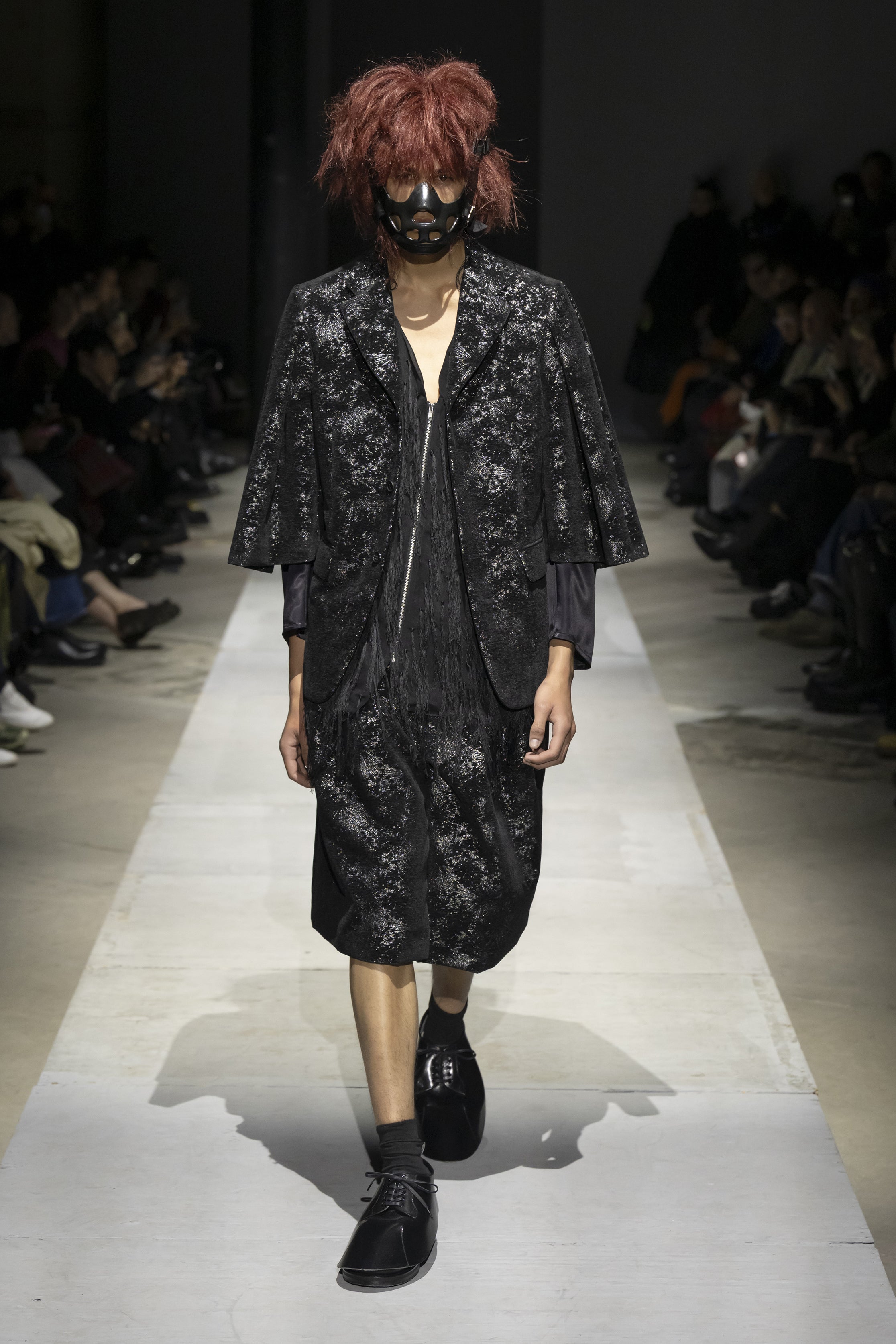 Fashion model wearing a COMME DES GARÇONS HOMME PLUS SS26 outfit