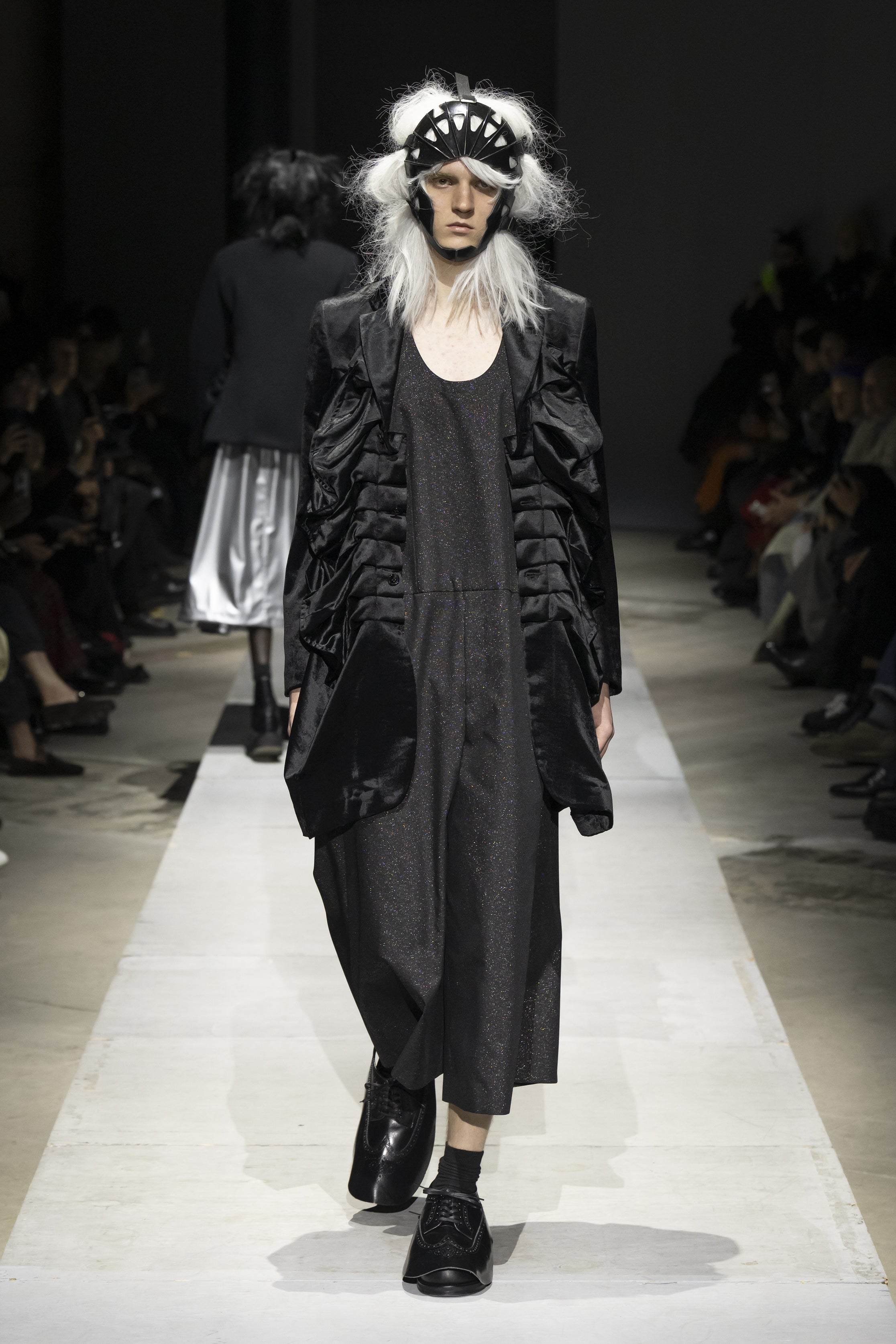 Fashion model wearing a COMME DES GARÇONS HOMME PLUS SS26 outfit