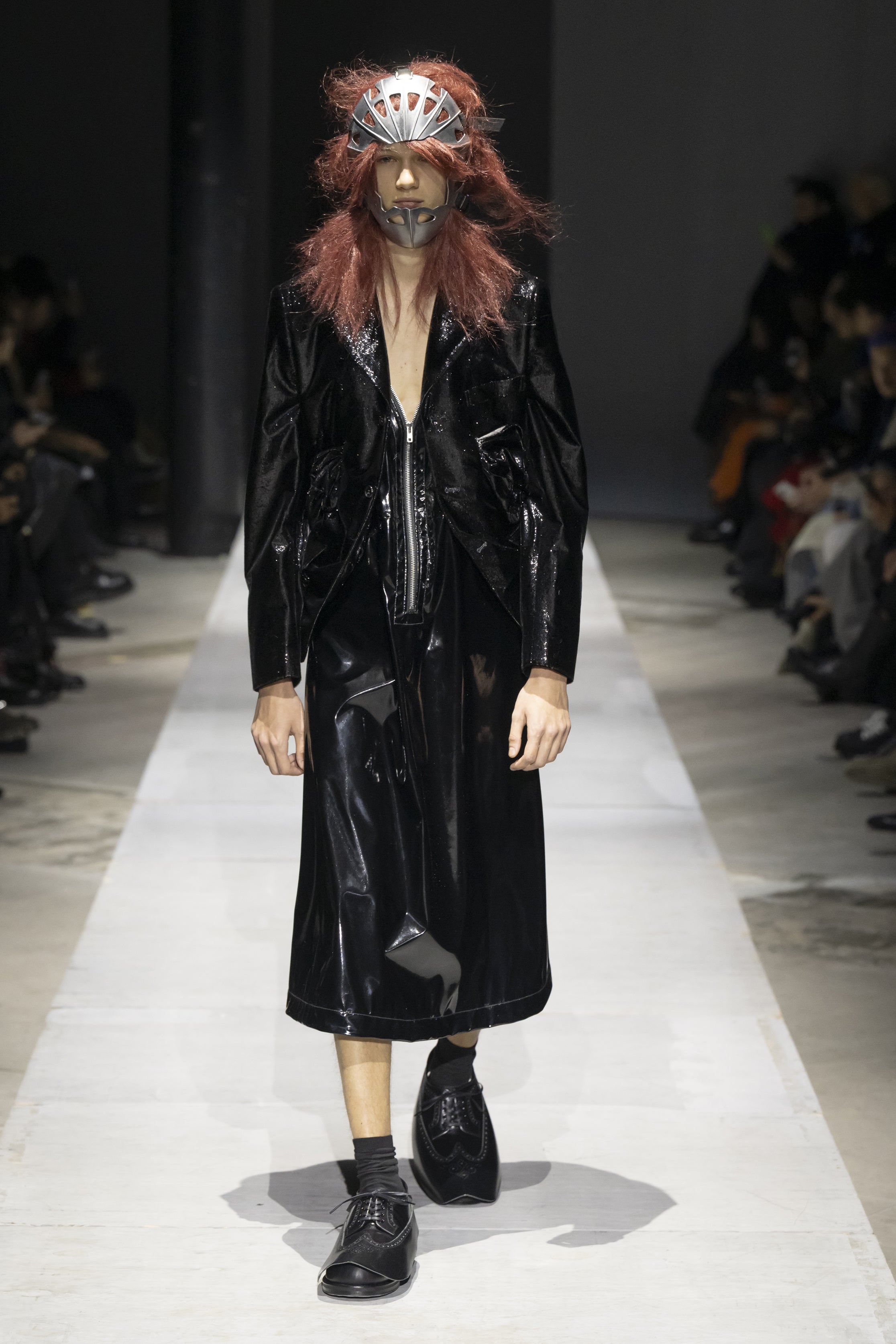 Fashion model wearing a COMME DES GARÇONS HOMME PLUS SS26 outfit