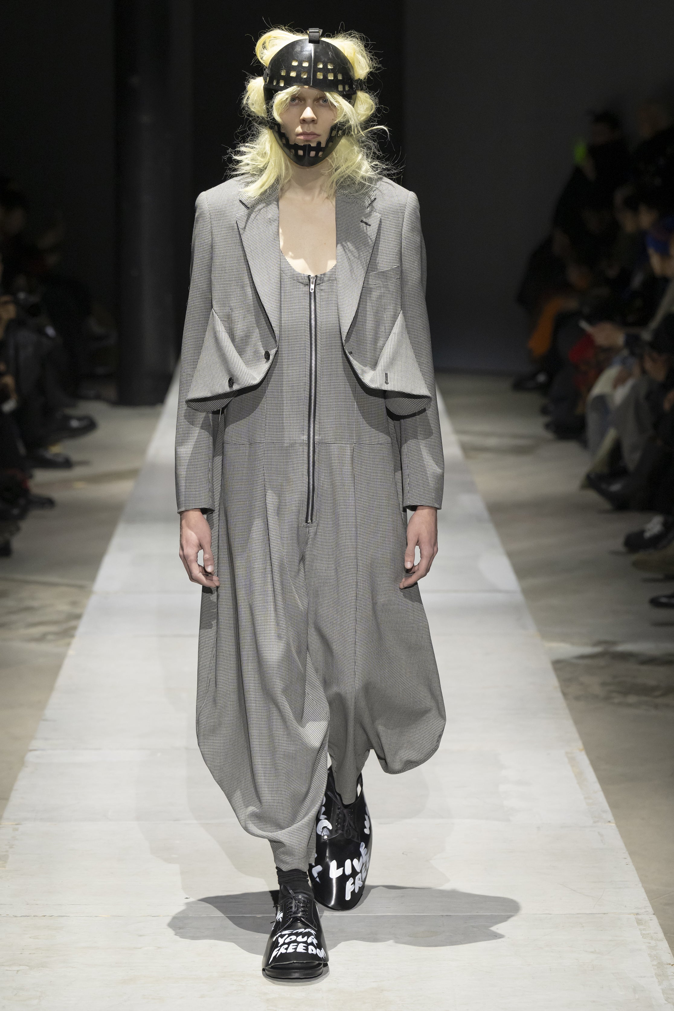 Fashion model wearing a COMME DES GARÇONS HOMME PLUS SS26 outfit