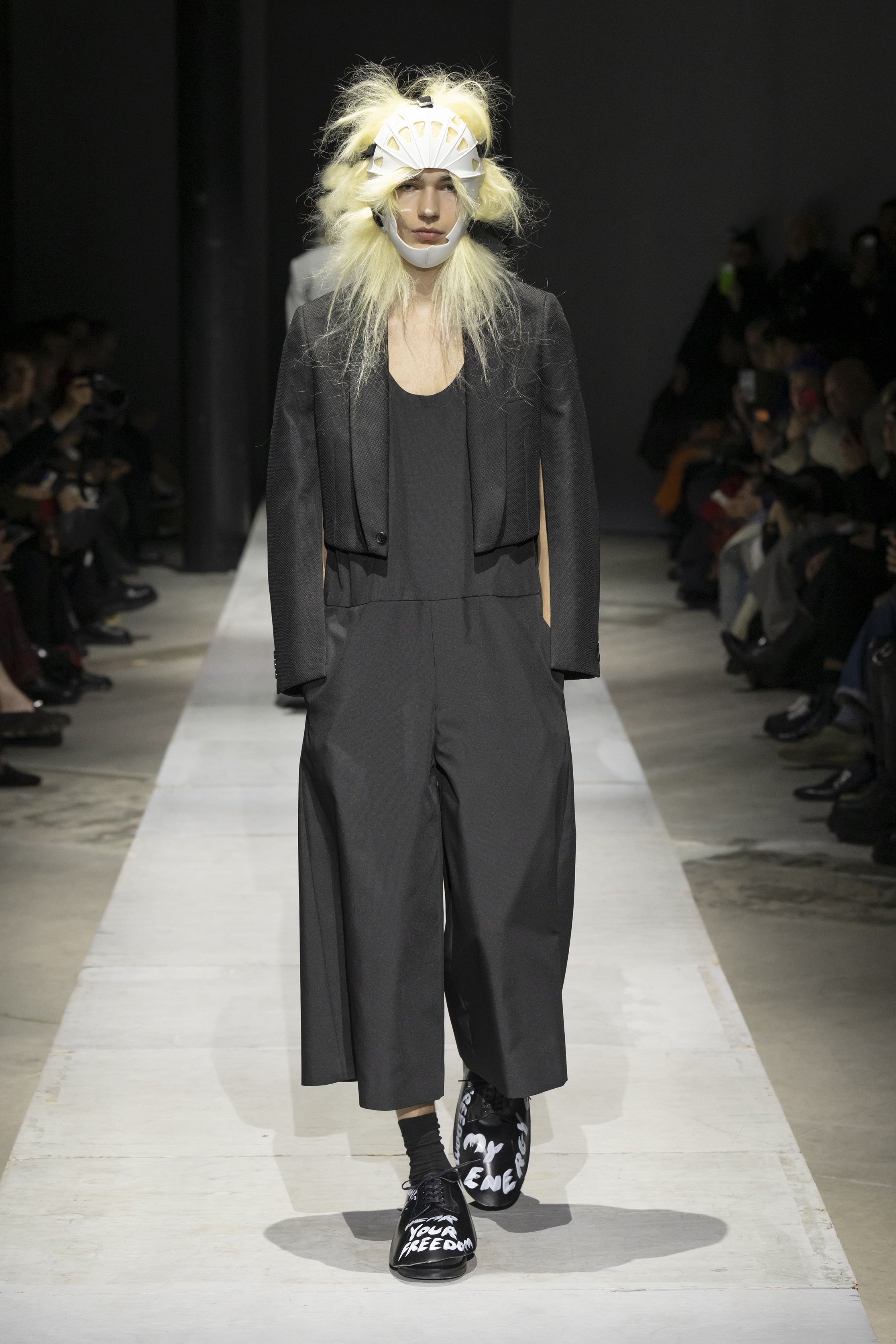 Fashion model wearing a COMME DES GARÇONS HOMME PLUS SS26 outfit