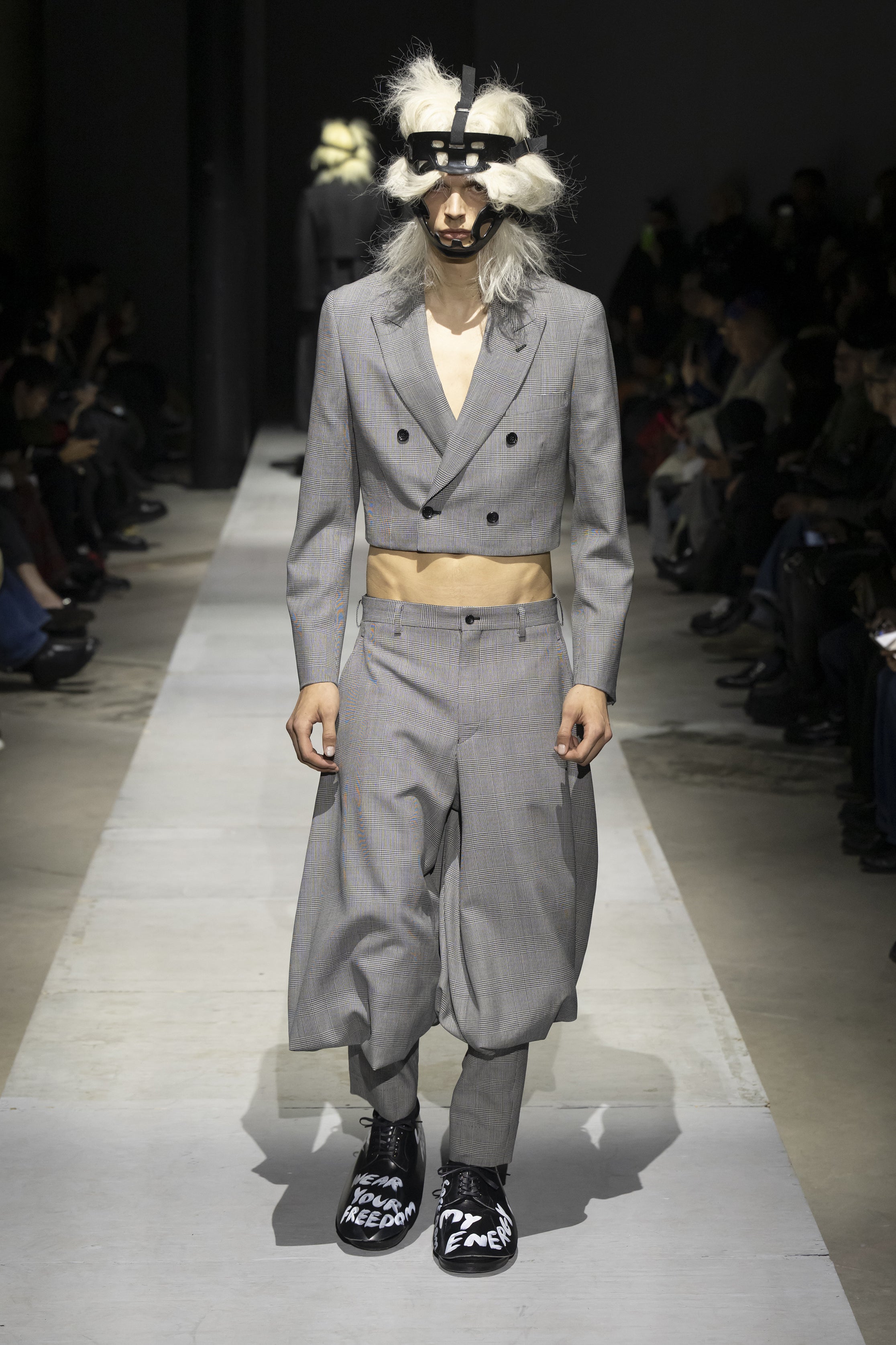 Fashion model wearing a COMME DES GARÇONS HOMME PLUS SS26 outfit