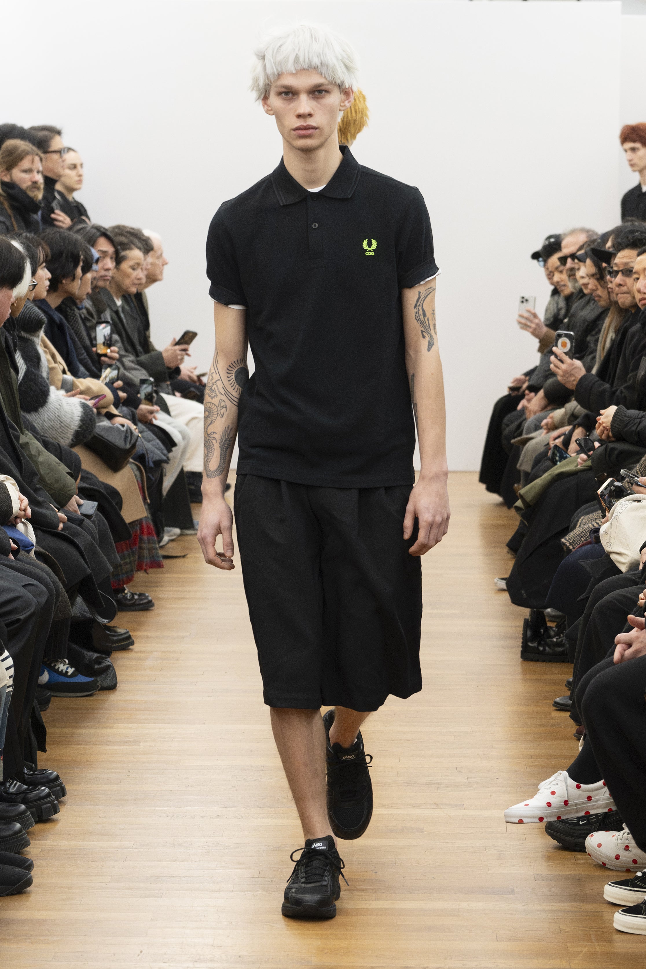 Fashion model wearing a COMME DES GARÇONS SHIRT AW26 outfit