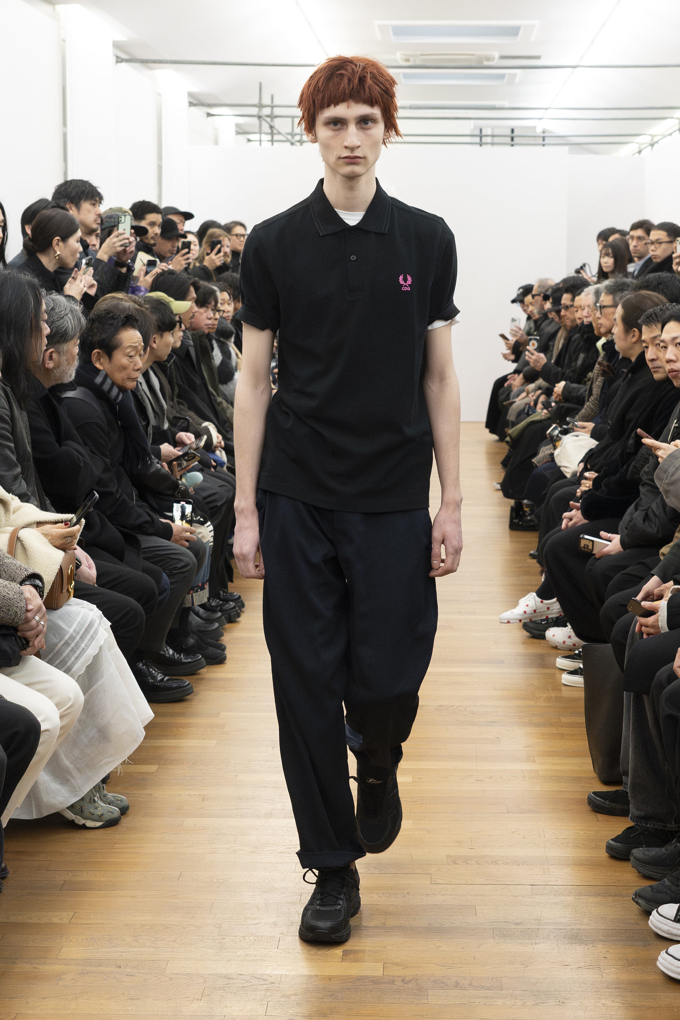 Fashion model wearing a COMME DES GARÇONS SHIRT AW26 outfit