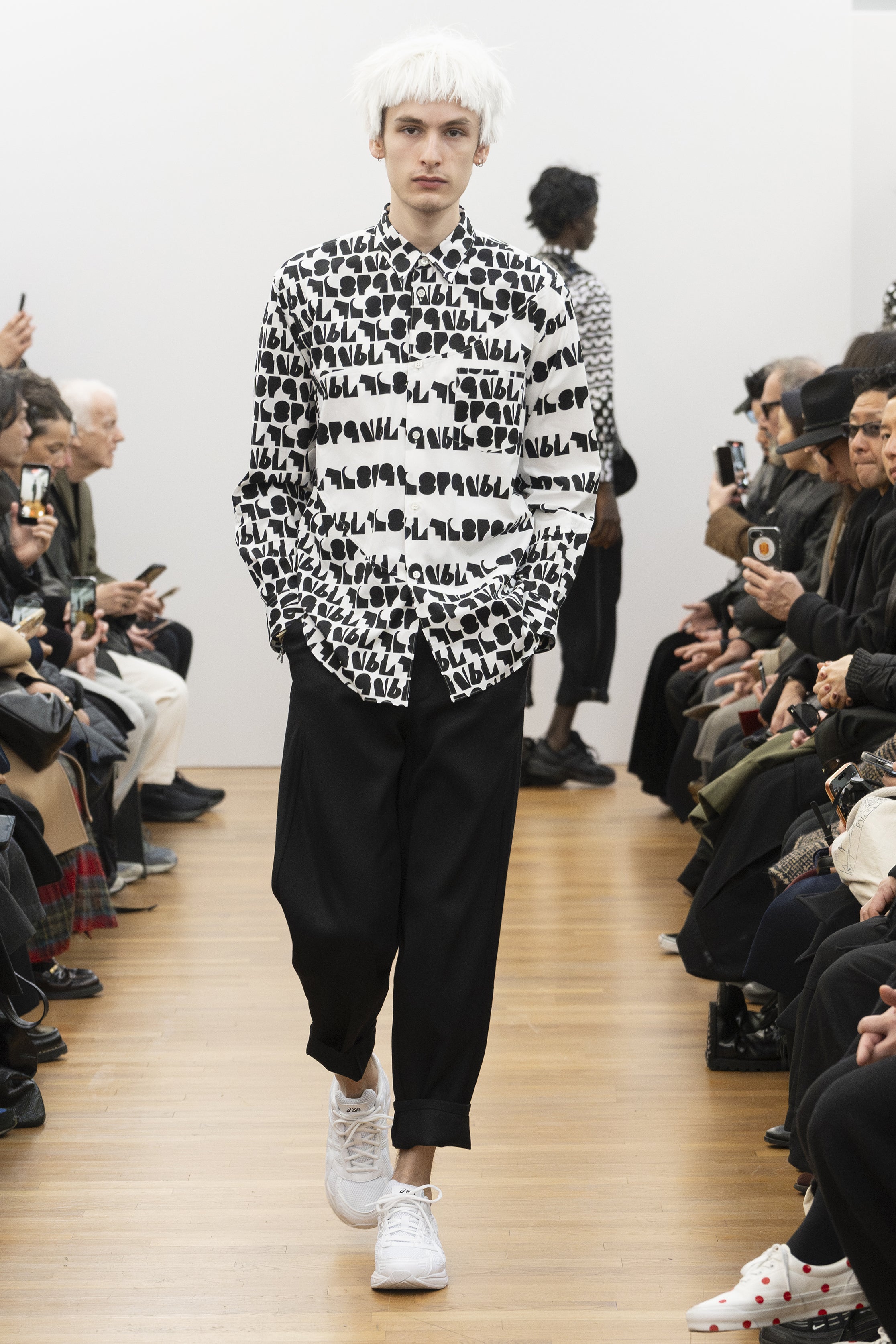 Fashion model wearing a COMME DES GARÇONS SHIRT AW26 outfit