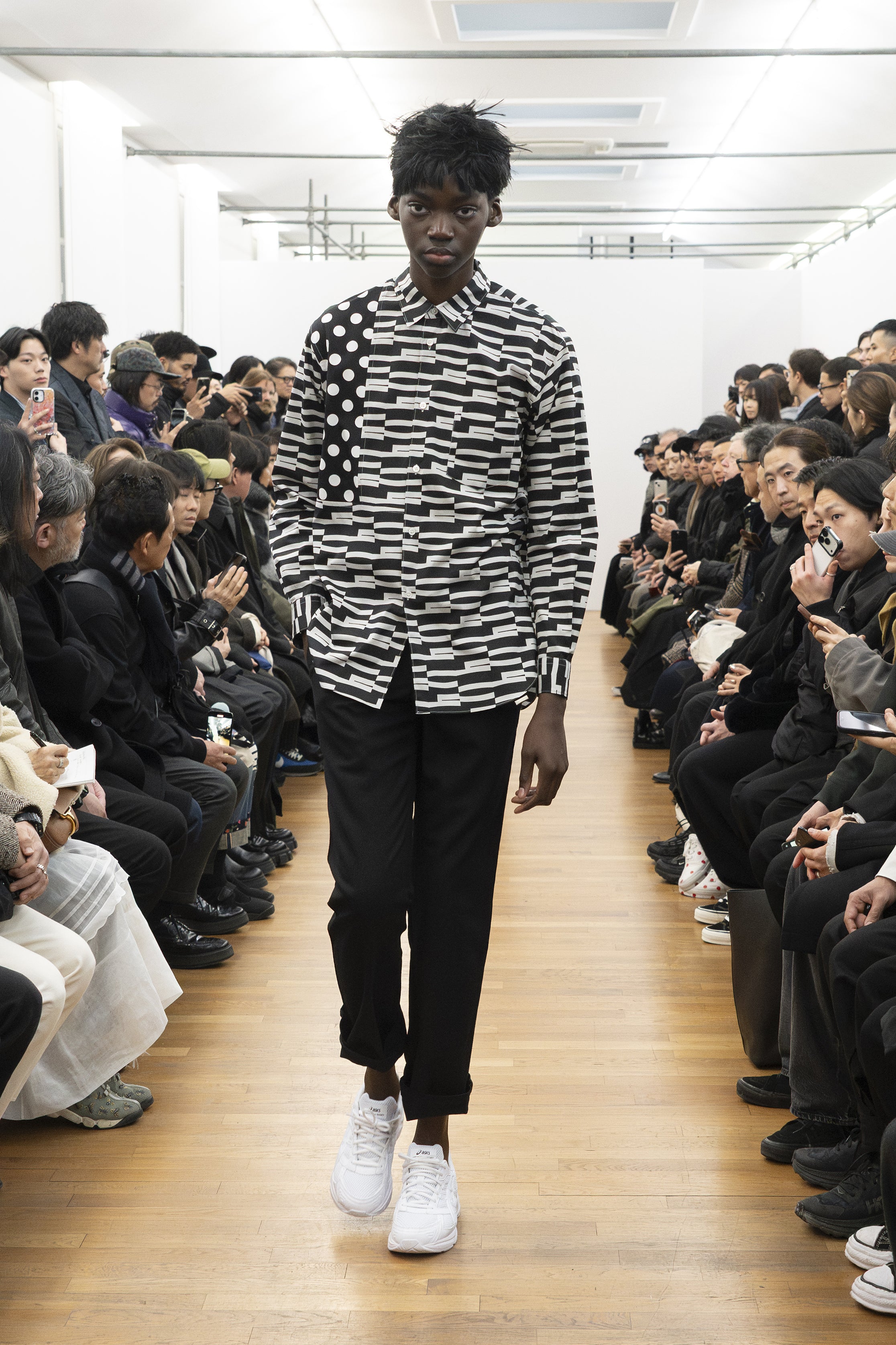 Fashion model wearing a COMME DES GARÇONS SHIRT AW26 outfit