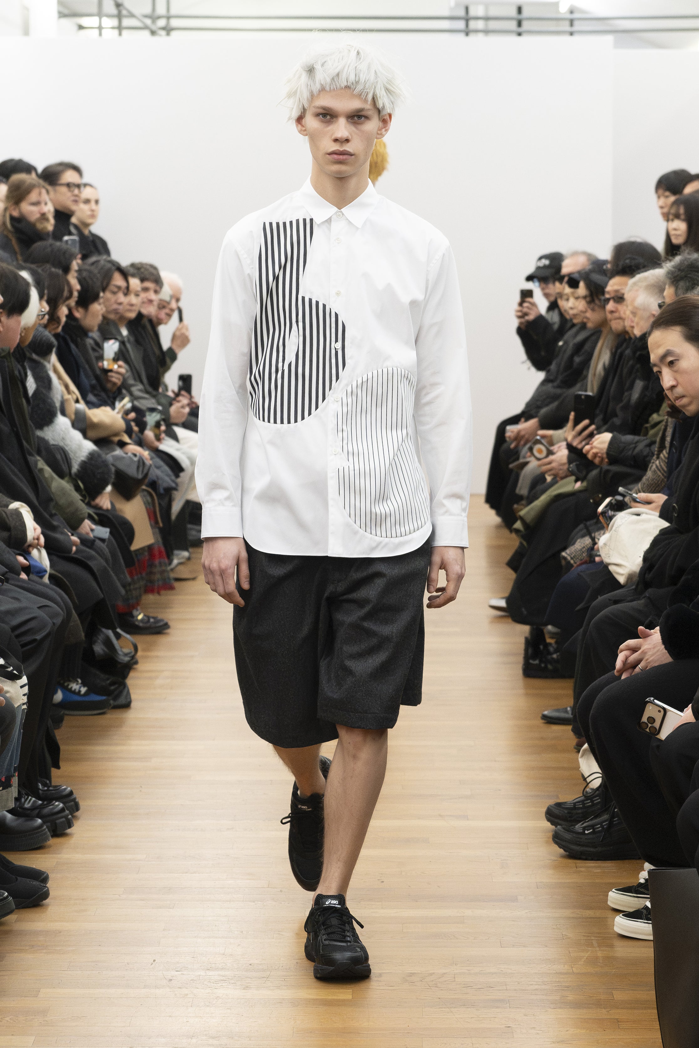 Fashion model wearing a COMME DES GARÇONS SHIRT AW26 outfit