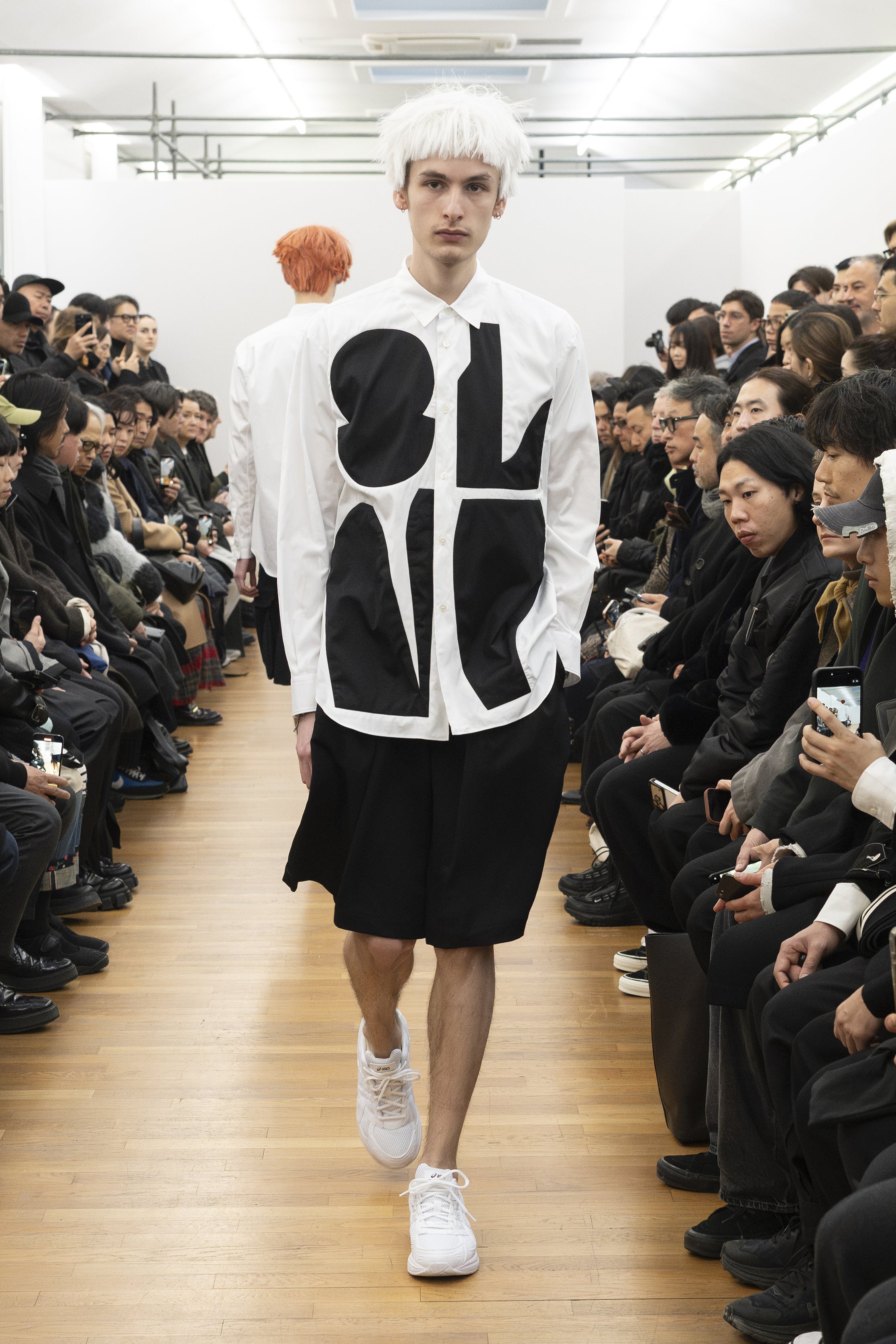 Fashion model wearing a COMME DES GARÇONS SHIRT AW26 outfit