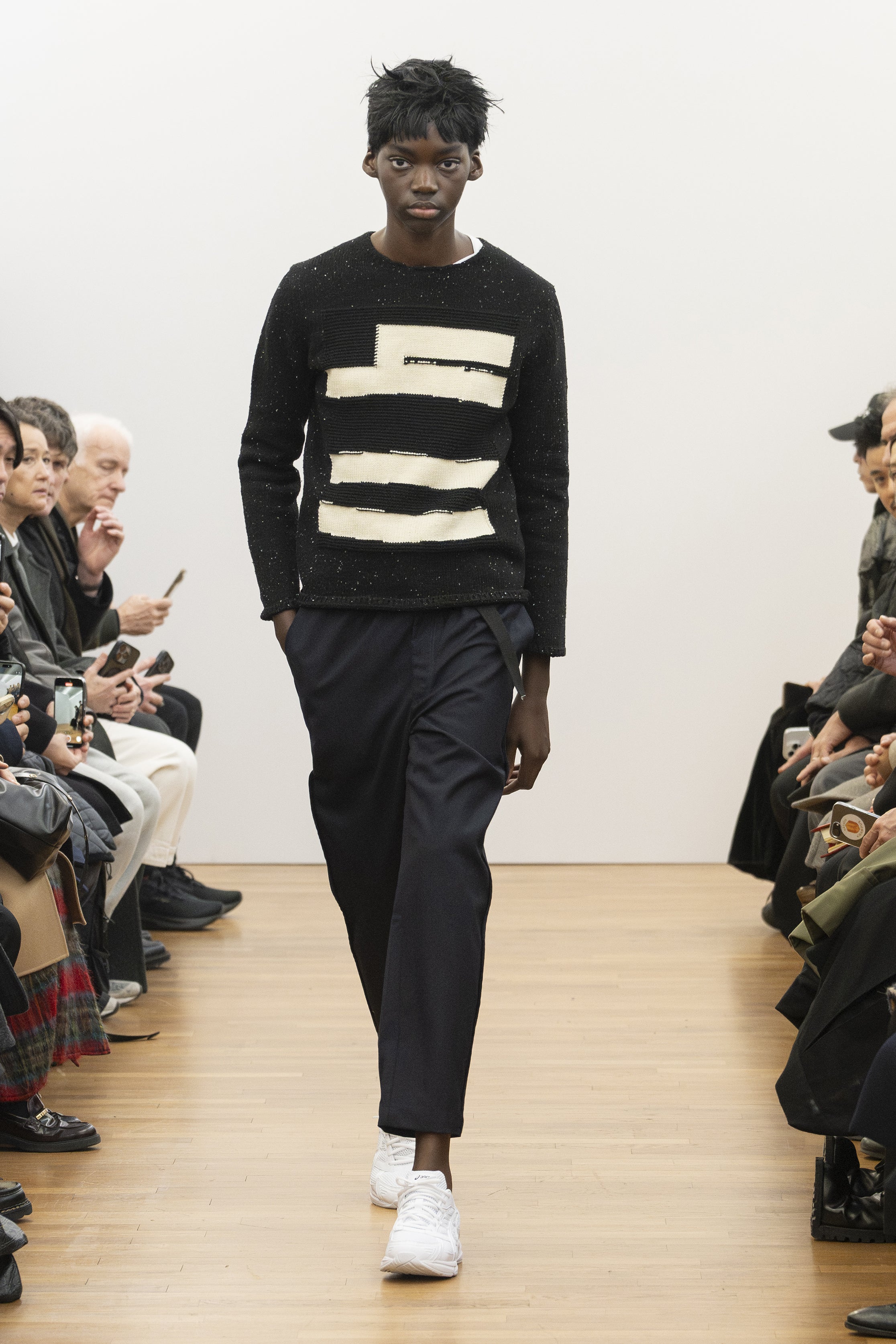Fashion model wearing a COMME DES GARÇONS SHIRT AW26 outfit