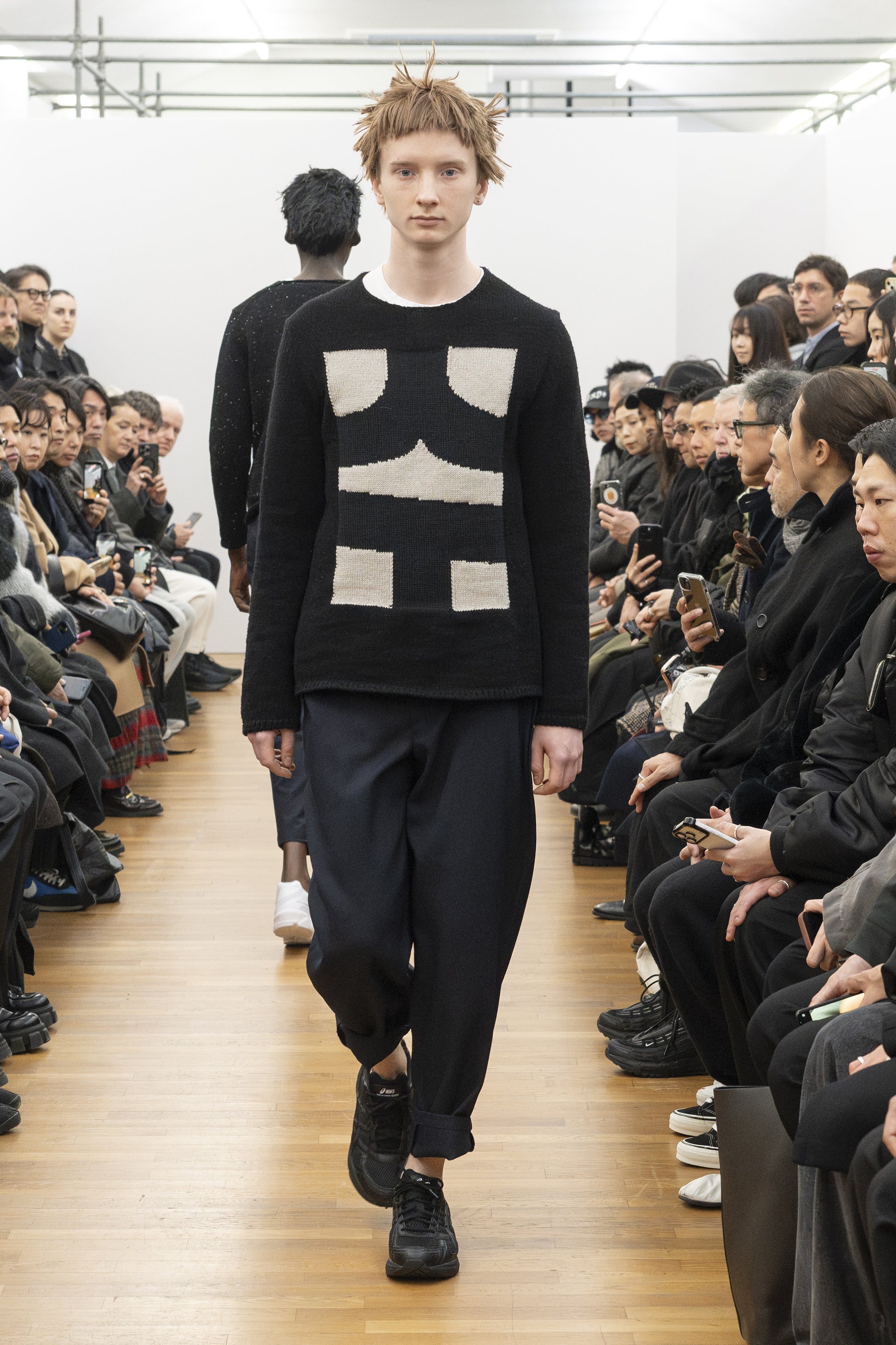 Fashion model wearing a COMME DES GARÇONS SHIRT AW26 outfit