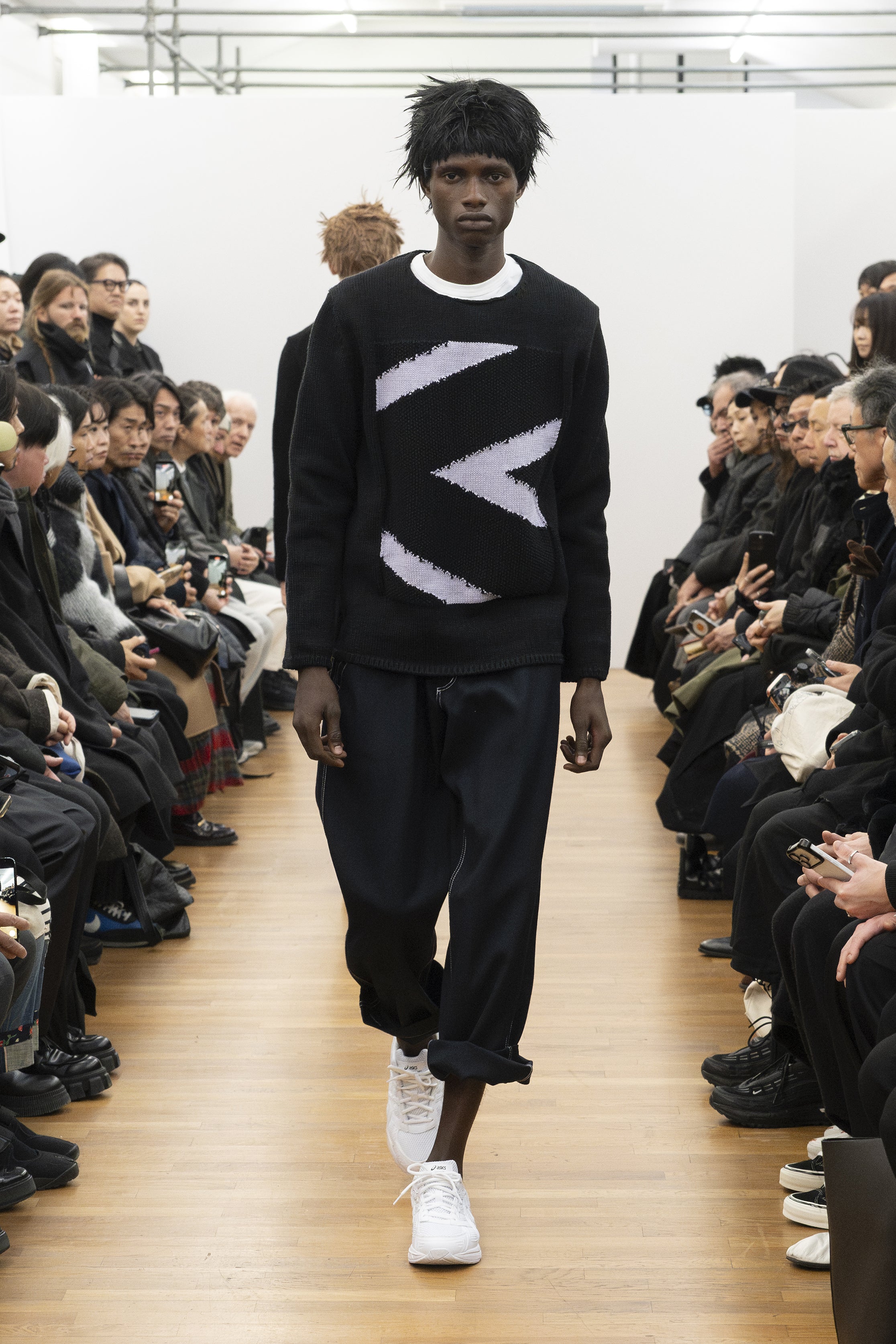 Fashion model wearing a COMME DES GARÇONS SHIRT AW26 outfit