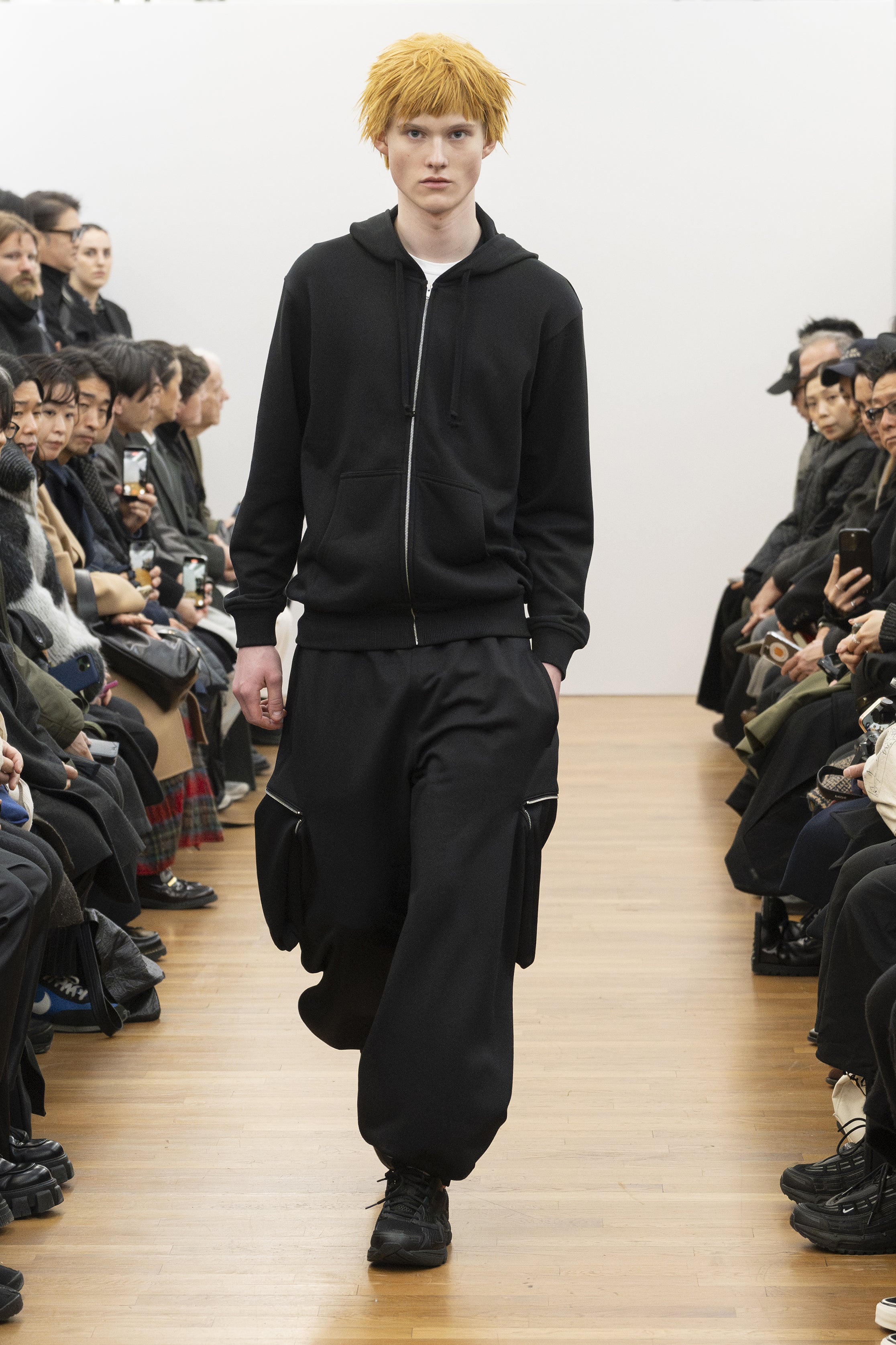 Fashion model wearing a COMME DES GARÇONS SHIRT AW26 outfit