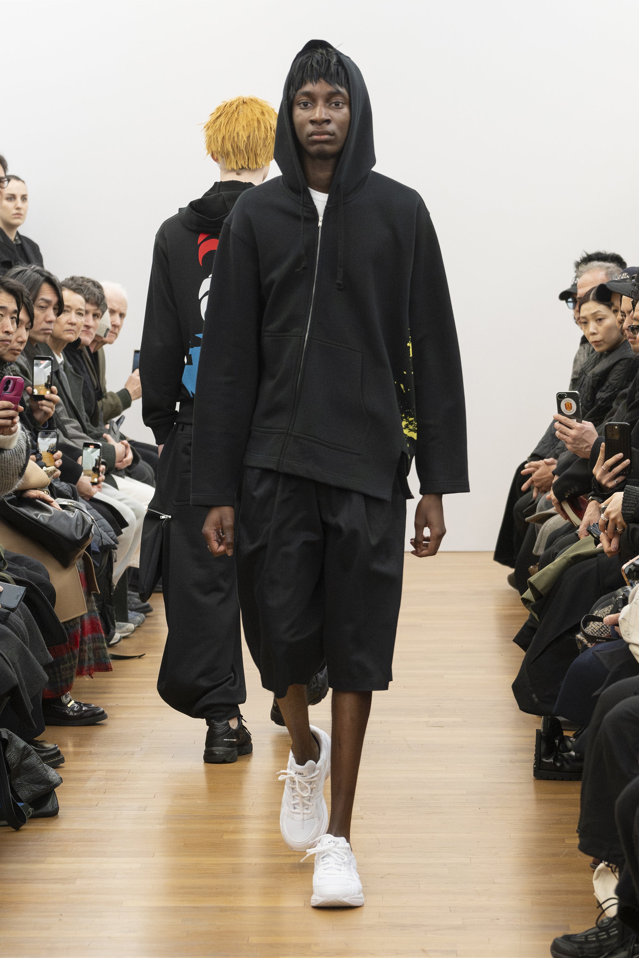 Fashion model wearing a COMME DES GARÇONS SHIRT AW26 outfit