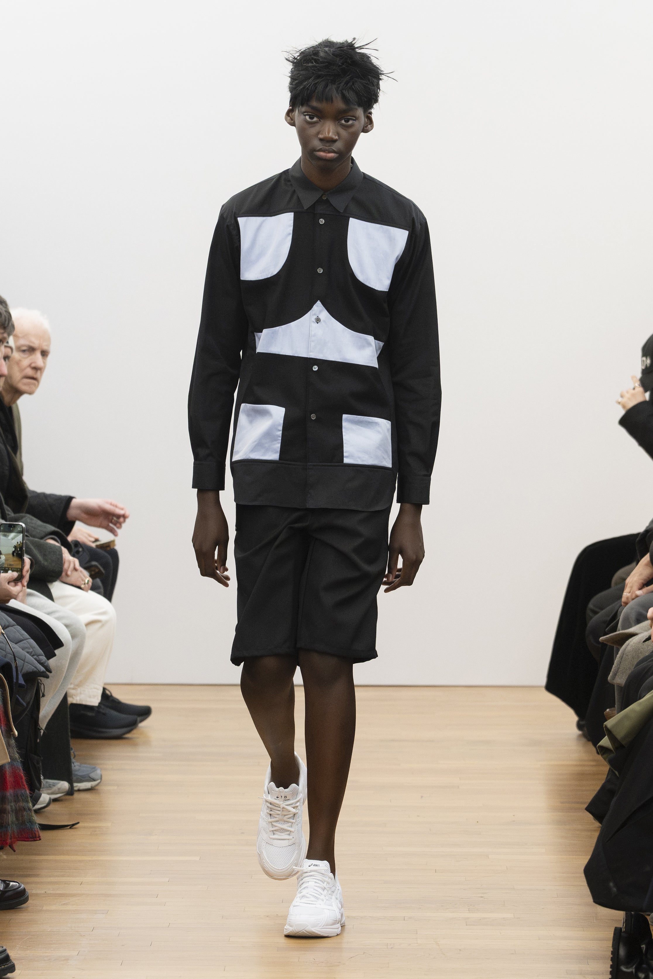 Fashion model wearing a COMME DES GARÇONS SHIRT AW26 outfit