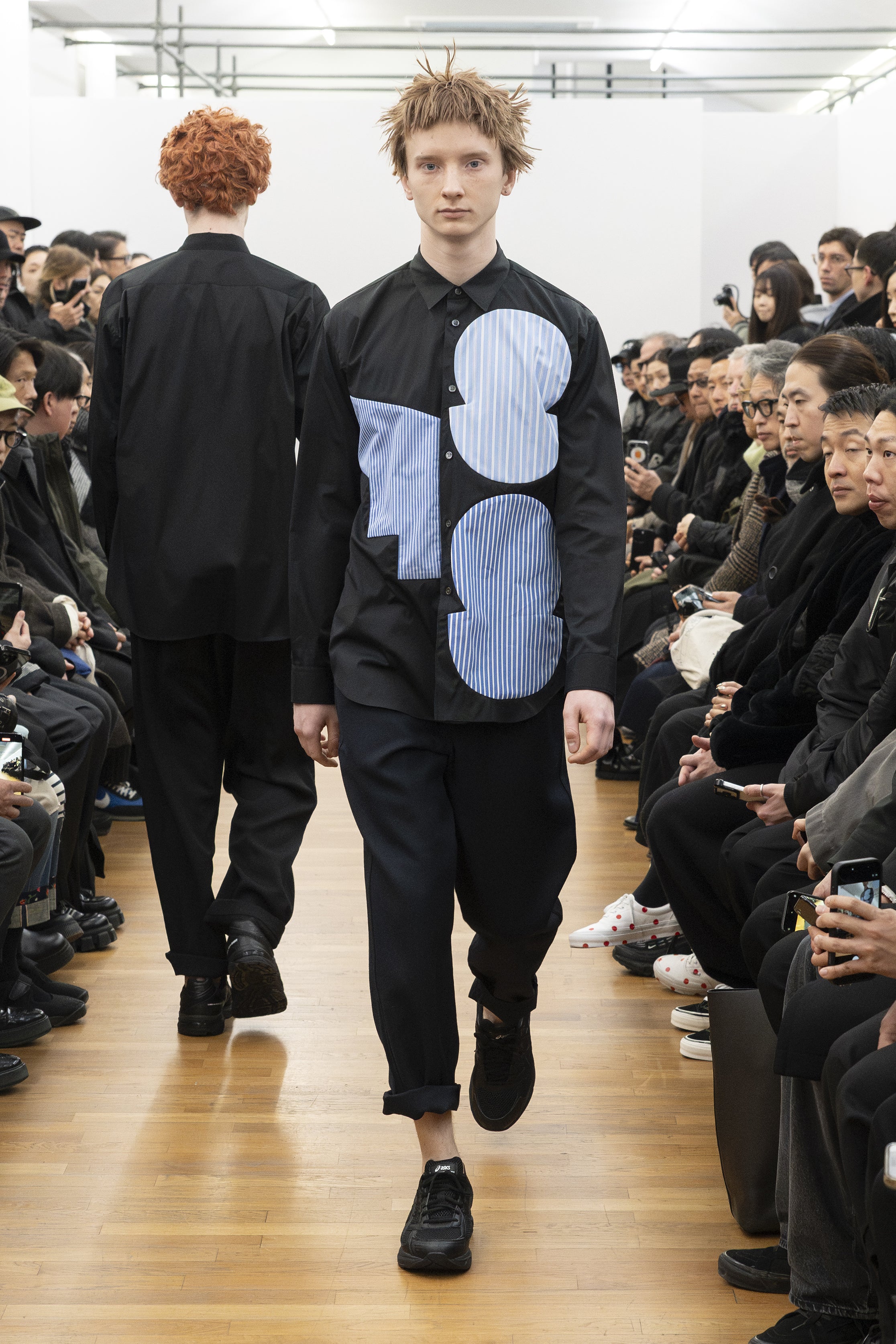 Fashion model wearing a COMME DES GARÇONS SHIRT AW26 outfit
