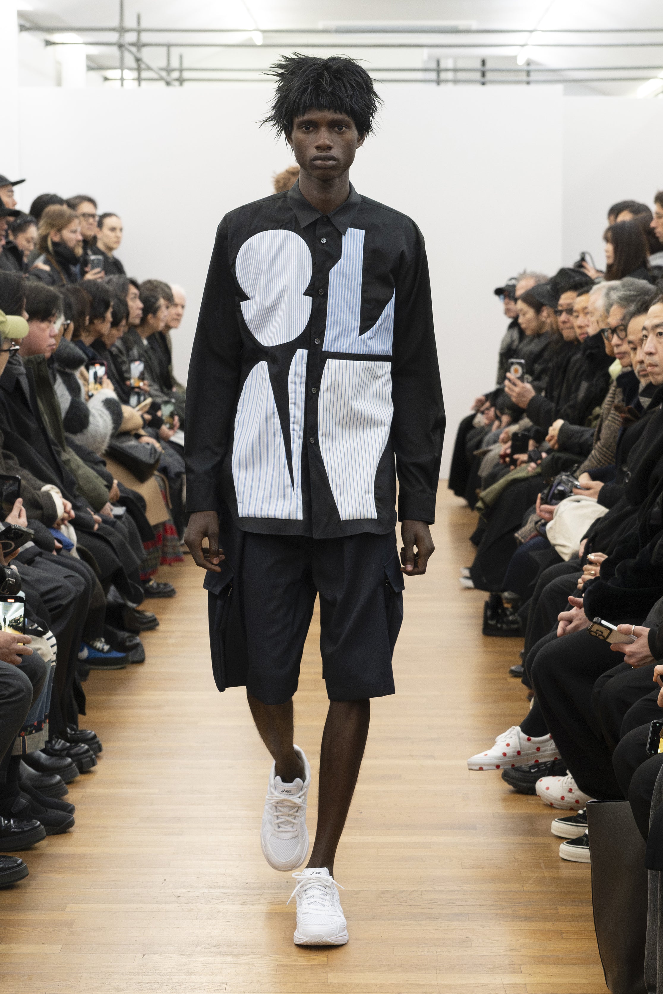 Fashion model wearing a COMME DES GARÇONS SHIRT AW26 outfit