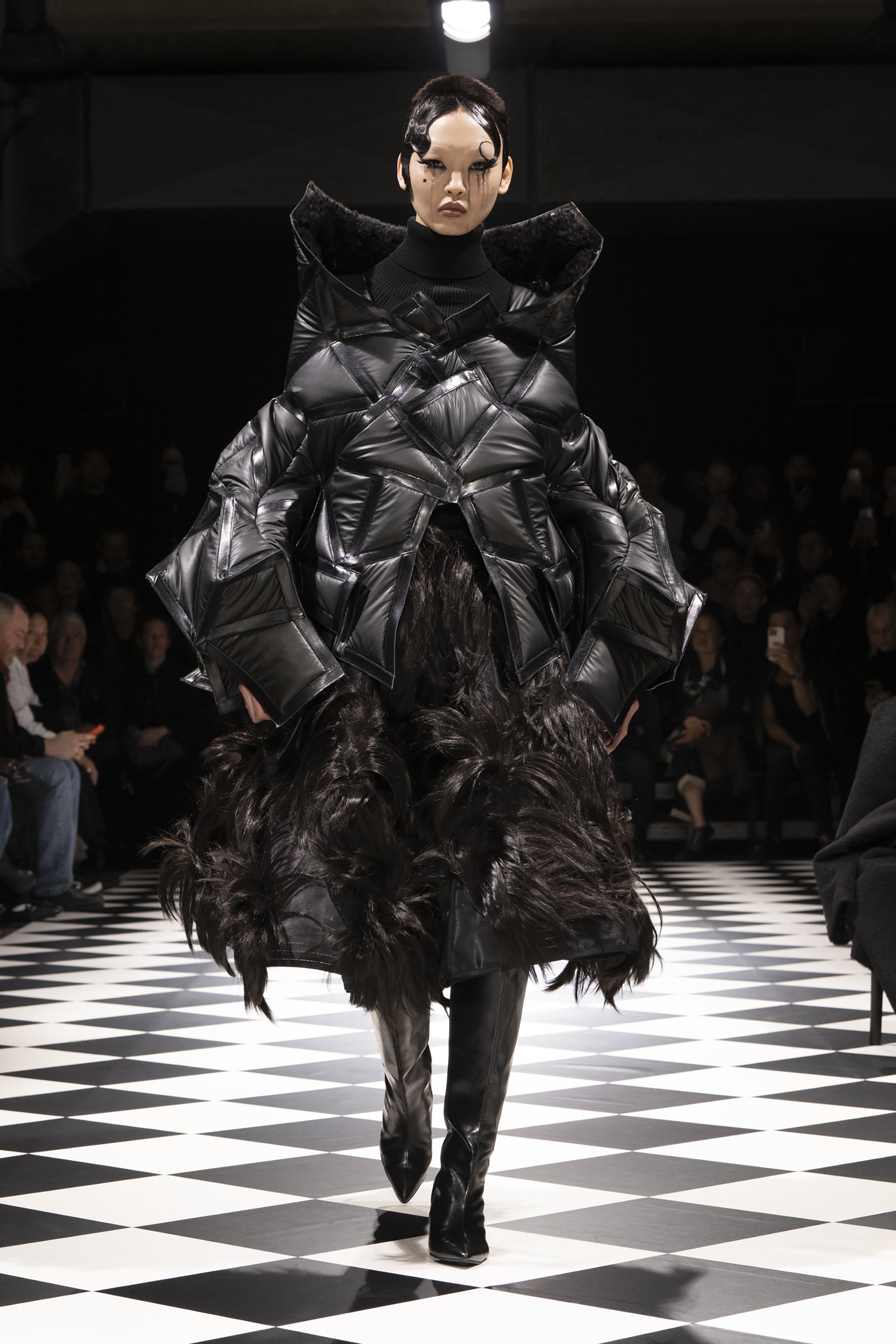 Fashion model wearing a JUNYA WATANABE AW26 outfit