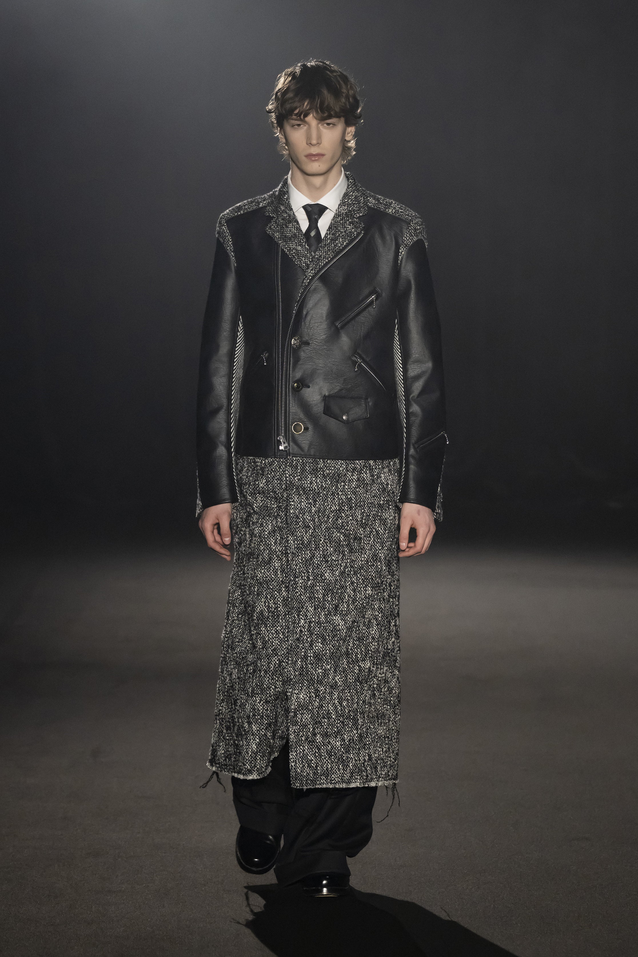 Fashion model wearing a JUNYA WATANABE MAN AW26 outfit
