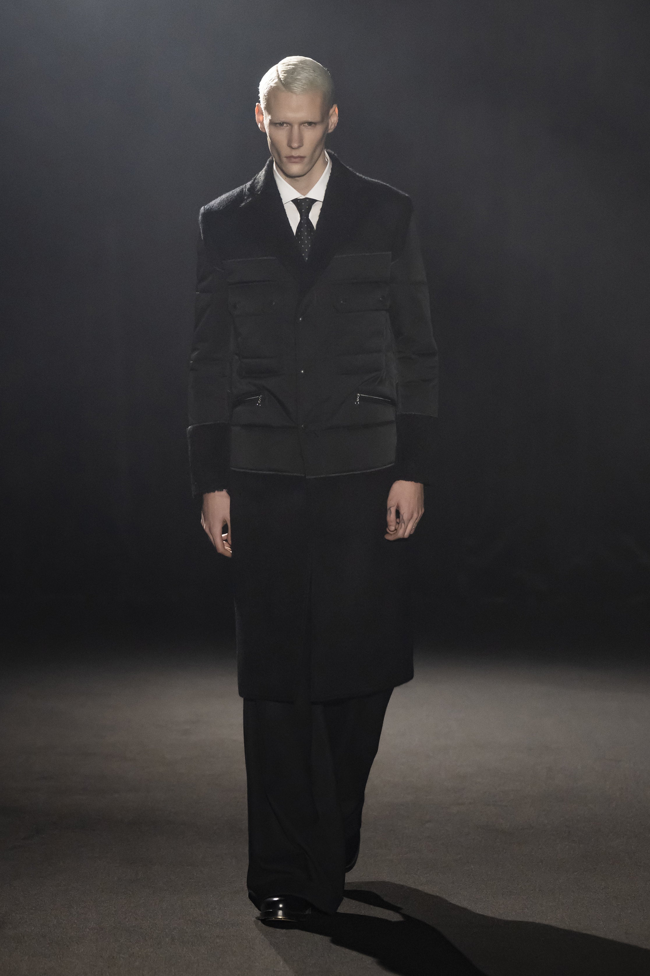Fashion model wearing a JUNYA WATANABE MAN AW26 outfit