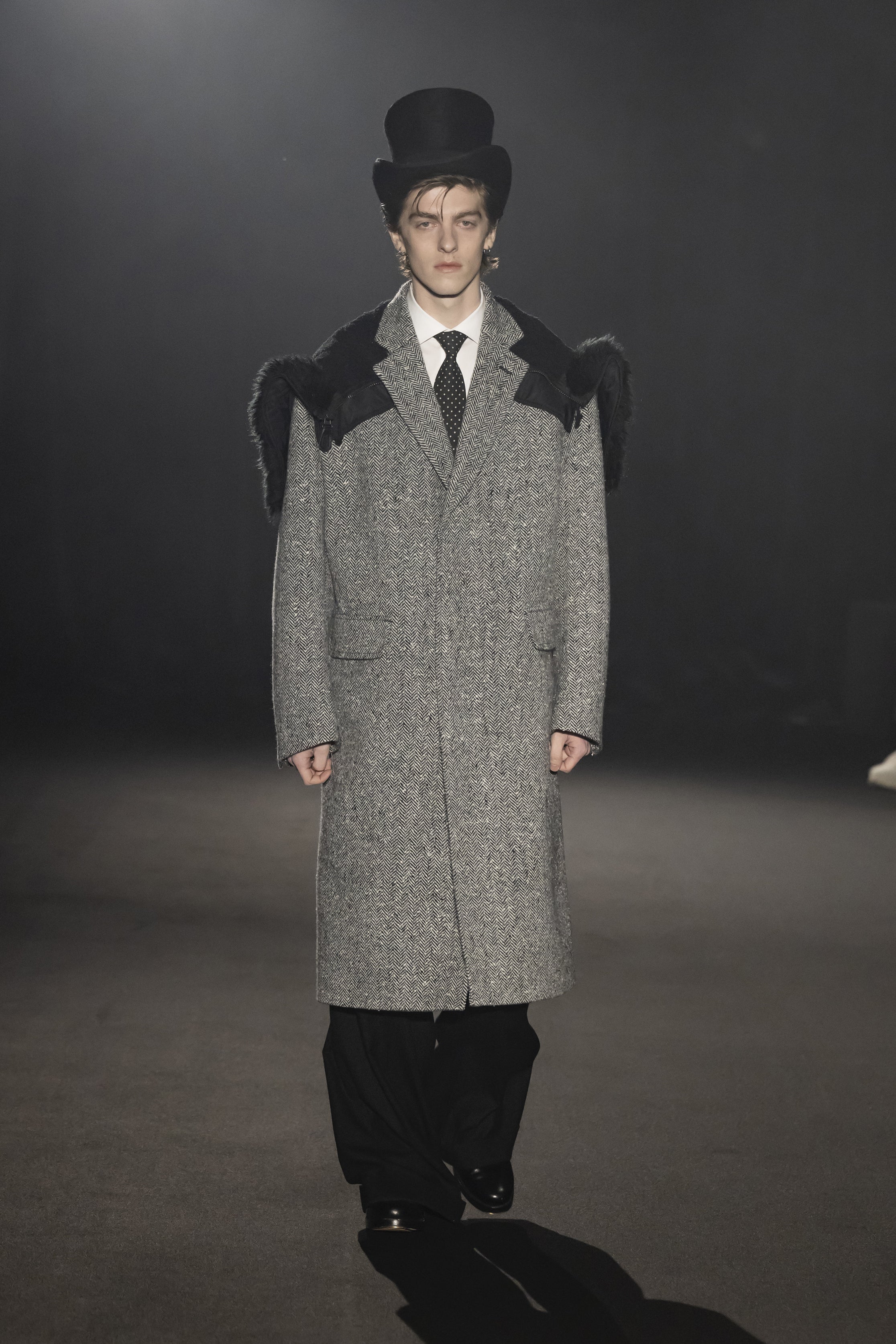Fashion model wearing a JUNYA WATANABE MAN AW26 outfit