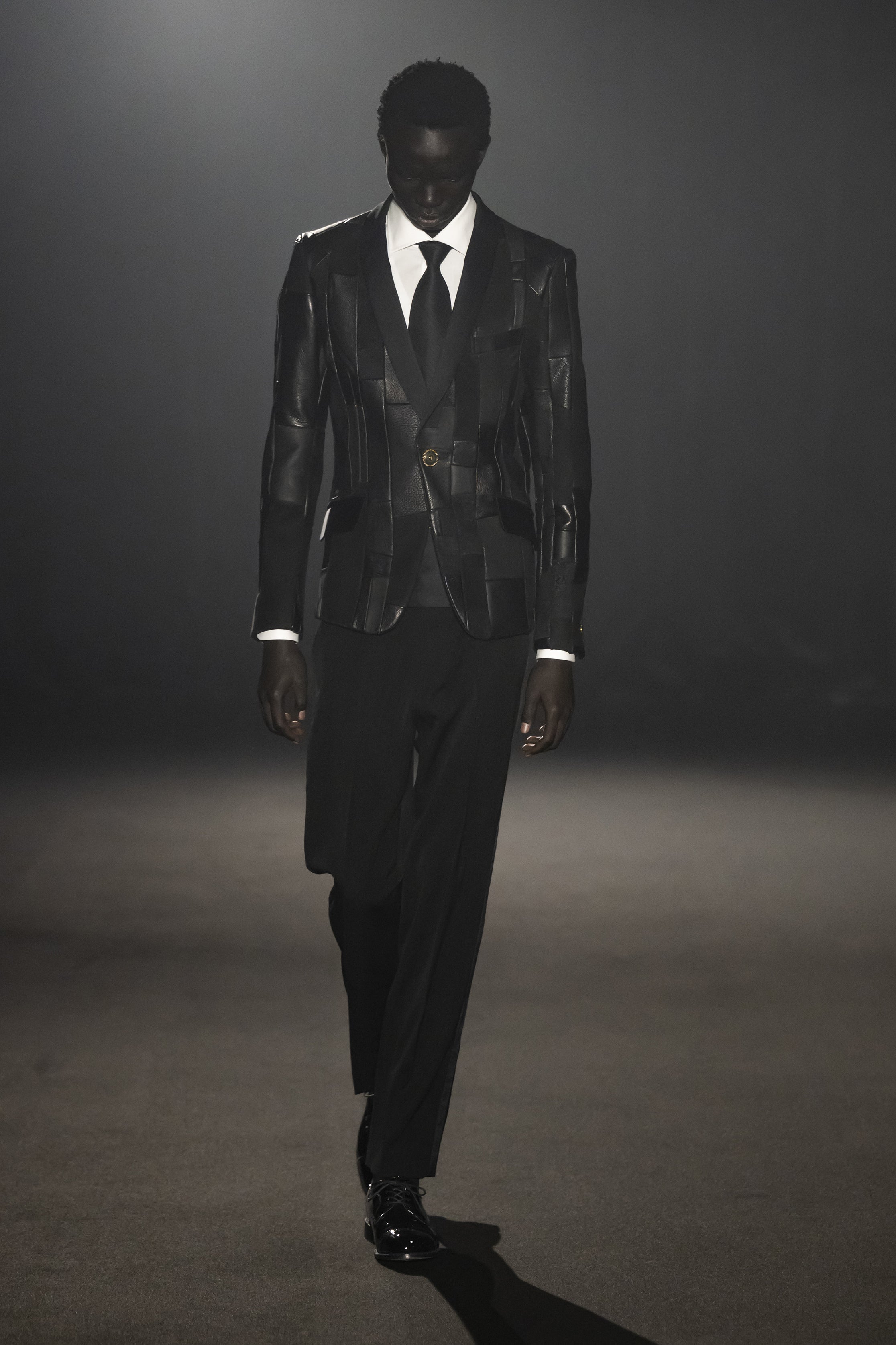 Fashion model wearing a JUNYA WATANABE MAN AW26 outfit