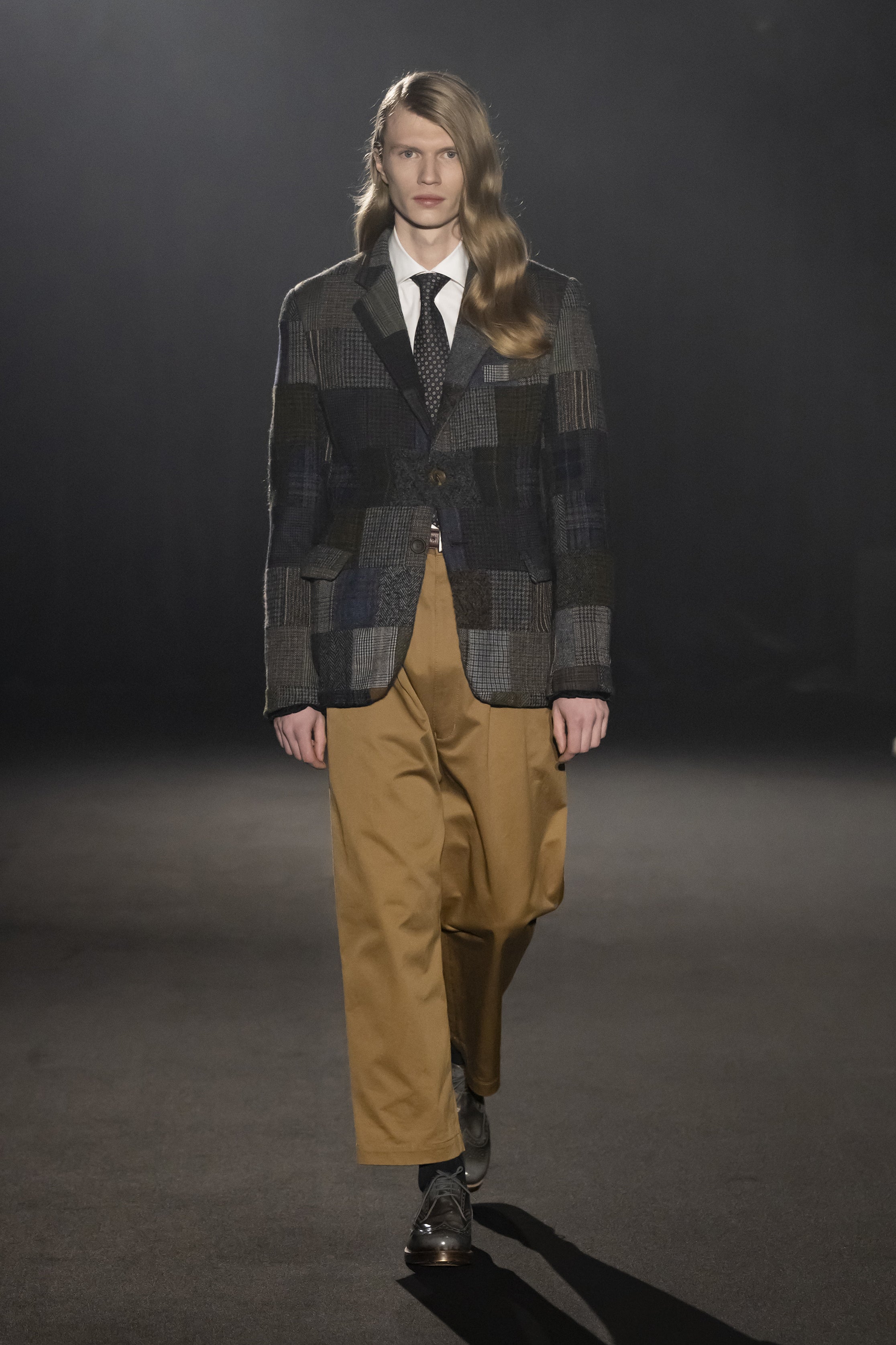 Fashion model wearing a JUNYA WATANABE MAN AW26 outfit