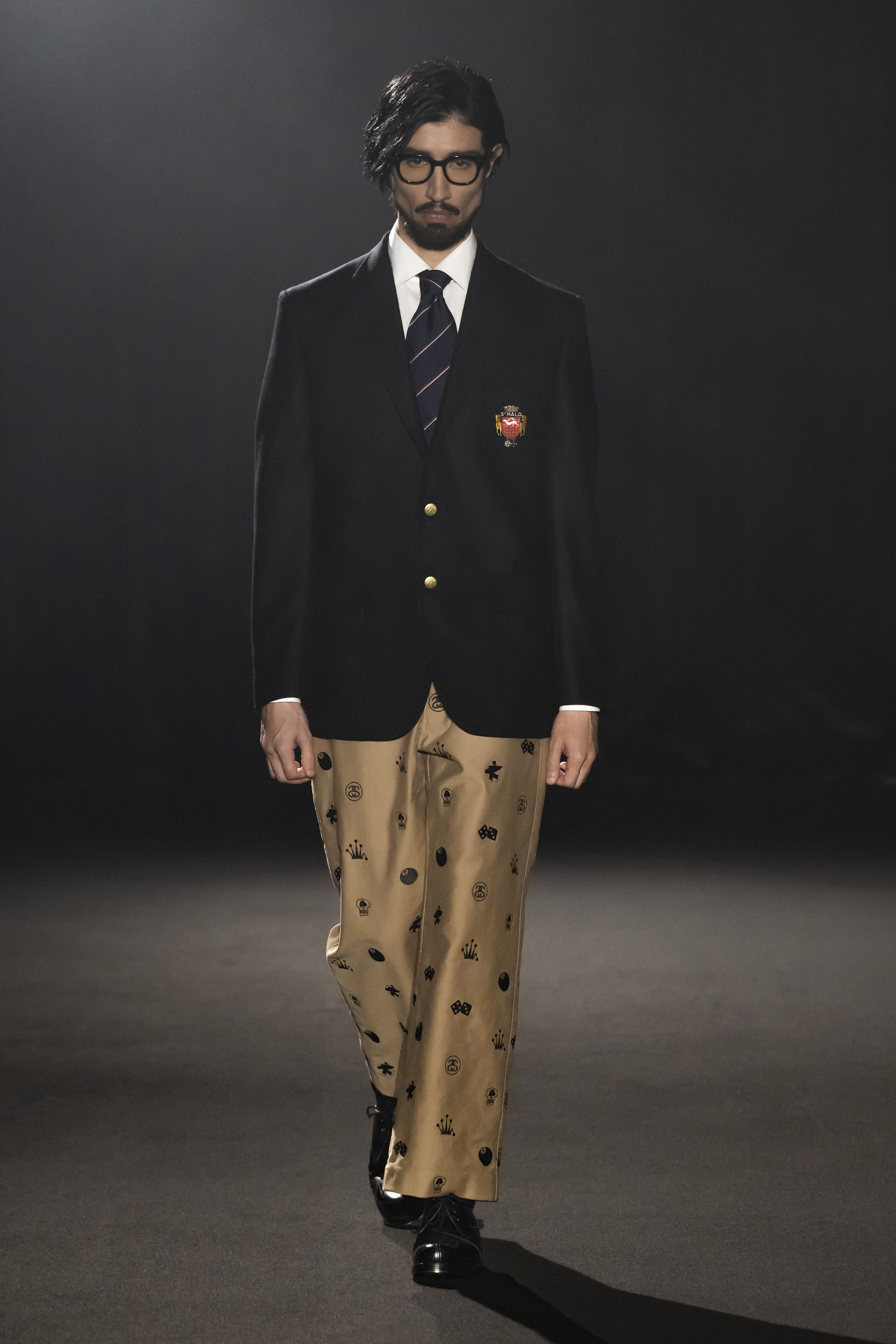 Fashion model wearing a JUNYA WATANABE MAN AW26 outfit