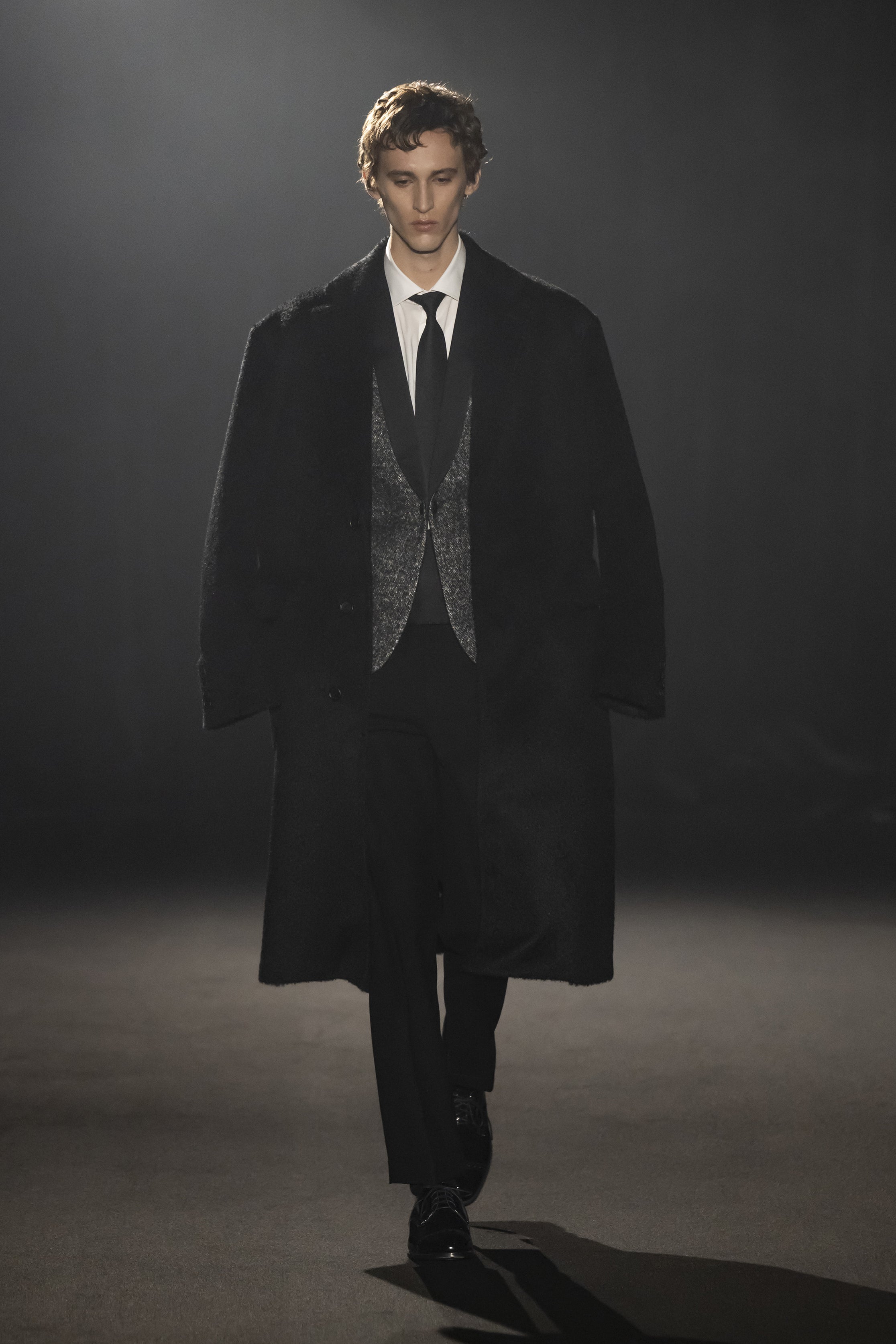 Fashion model wearing a JUNYA WATANABE MAN AW26 outfit