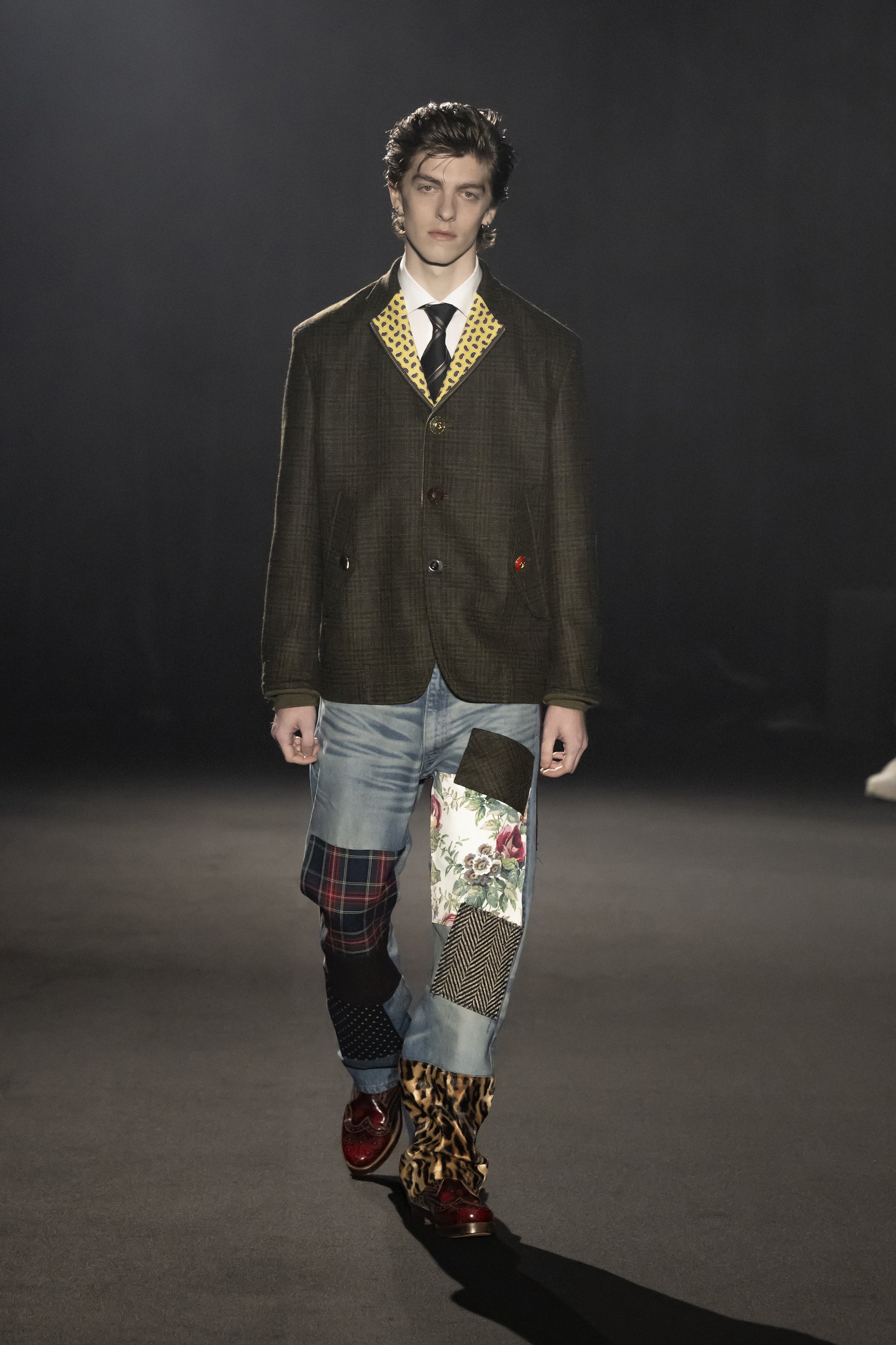 Fashion model wearing a JUNYA WATANABE MAN AW26 outfit