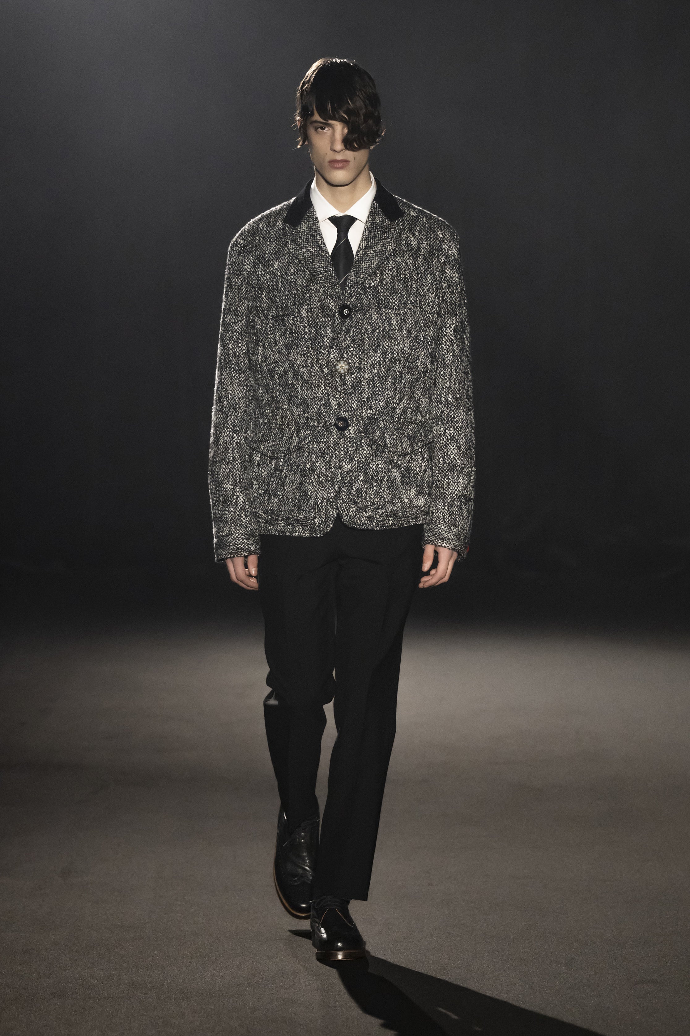 Fashion model wearing a JUNYA WATANABE MAN AW26 outfit