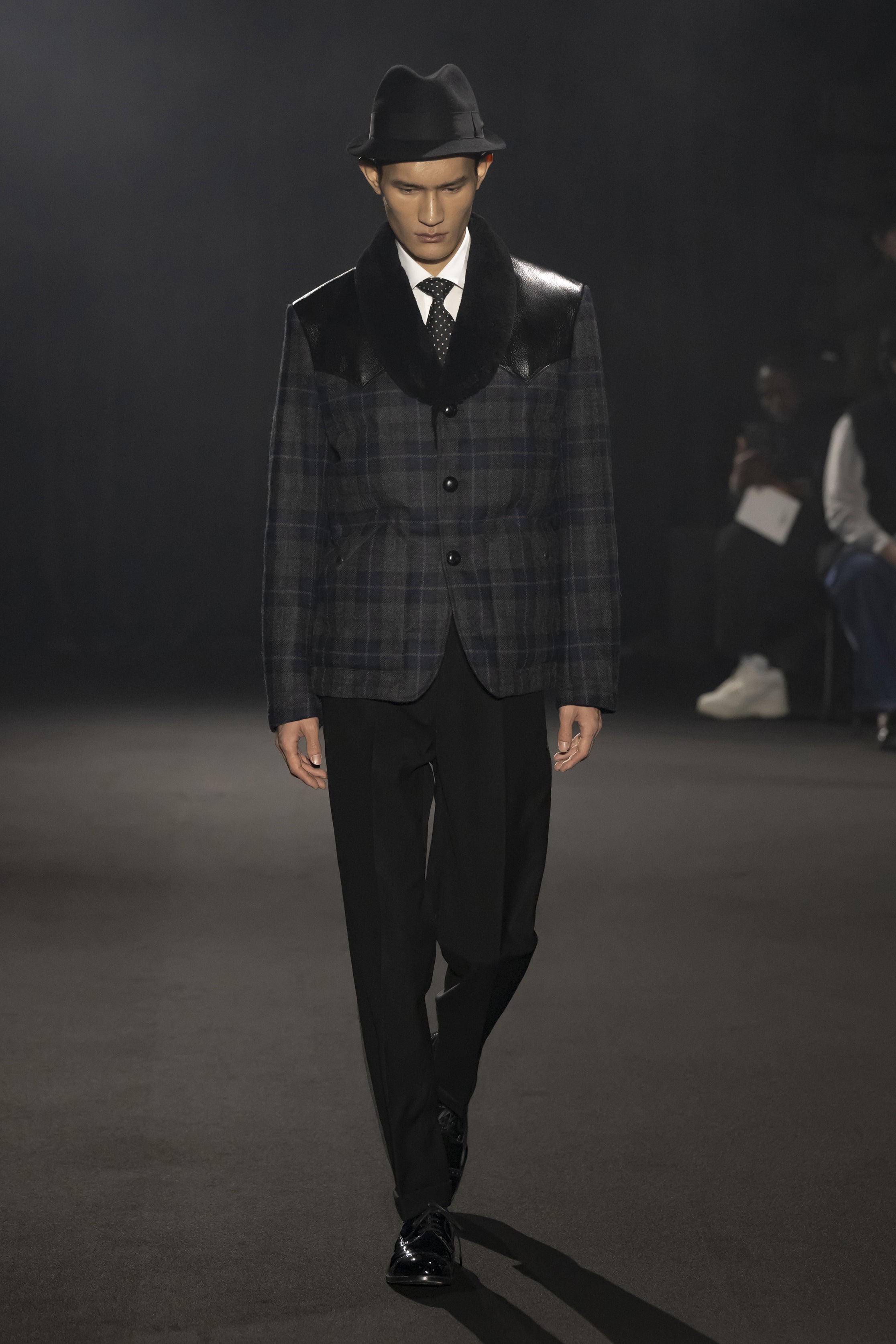 Fashion model wearing a JUNYA WATANABE MAN AW26 outfit