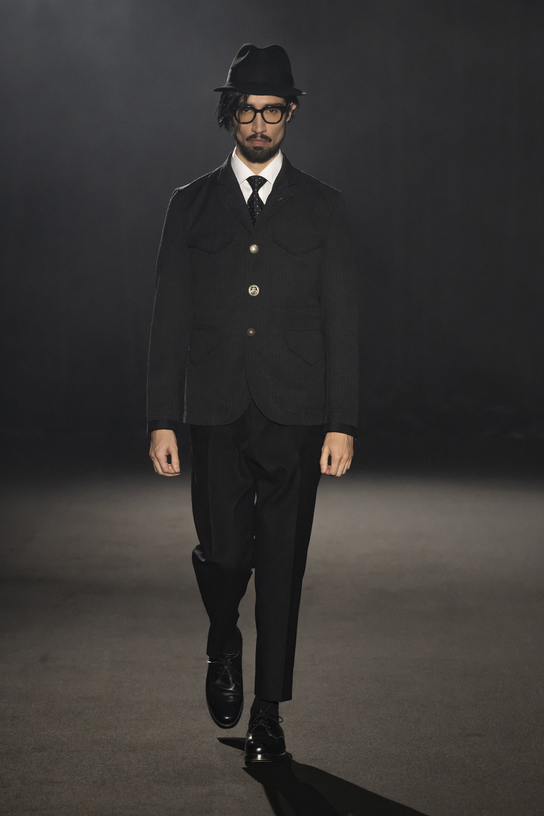 Fashion model wearing a JUNYA WATANABE MAN AW26 outfit