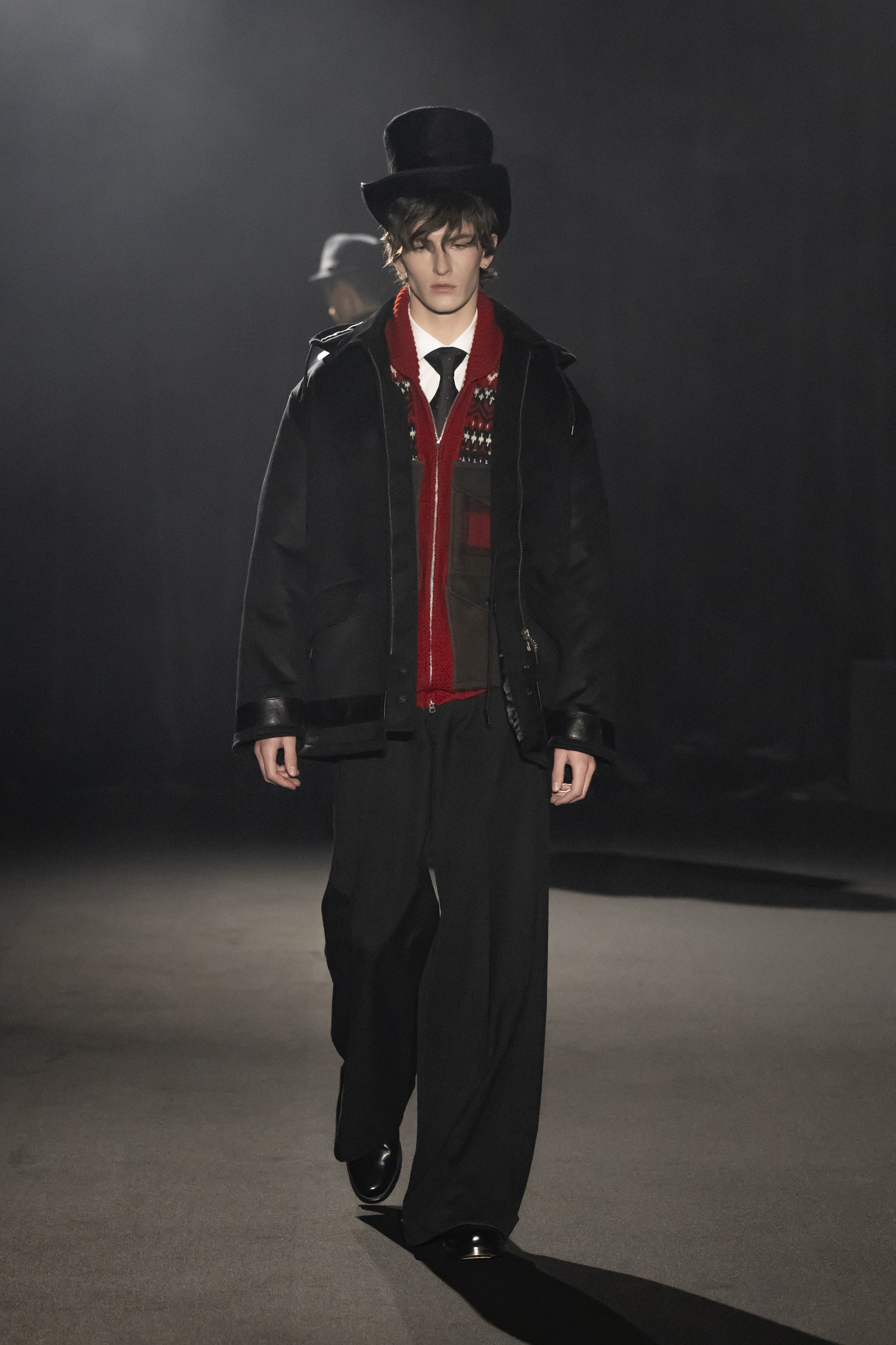 Fashion model wearing a JUNYA WATANABE MAN AW26 outfit