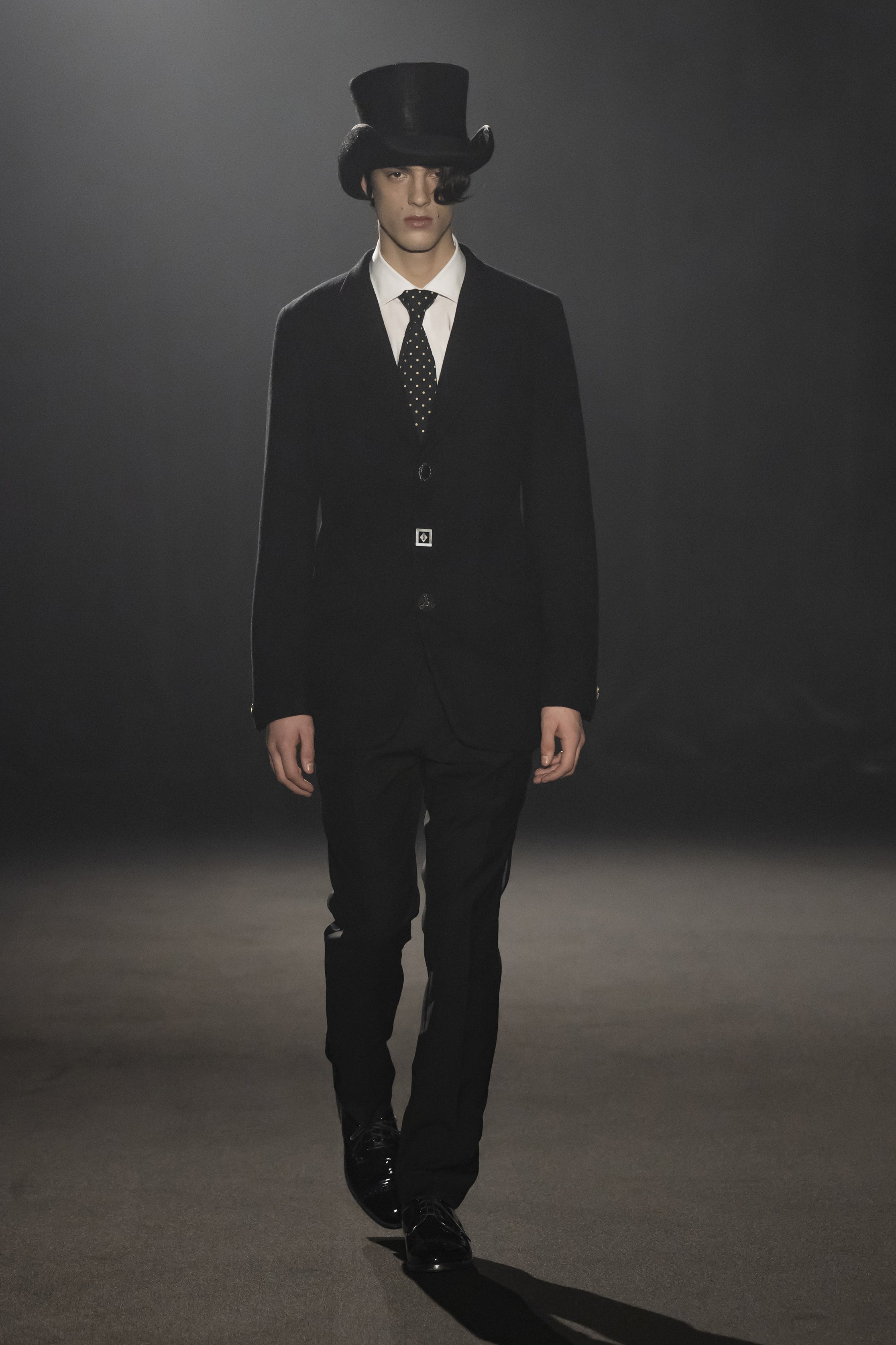 Fashion model wearing a JUNYA WATANABE MAN AW26 outfit