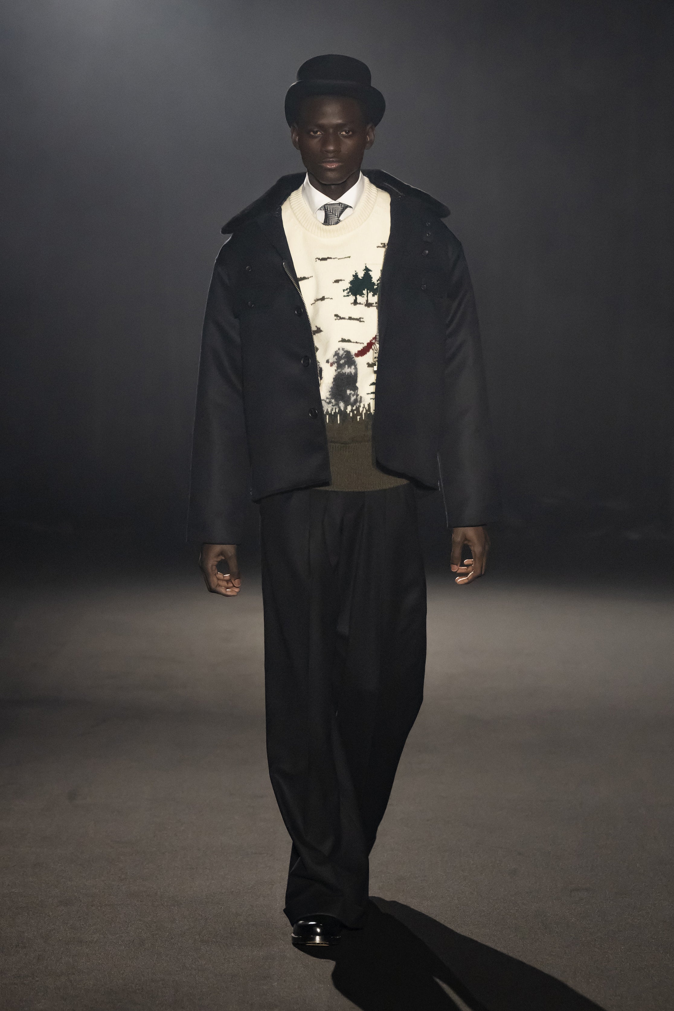 Fashion model wearing a JUNYA WATANABE MAN AW26 outfit