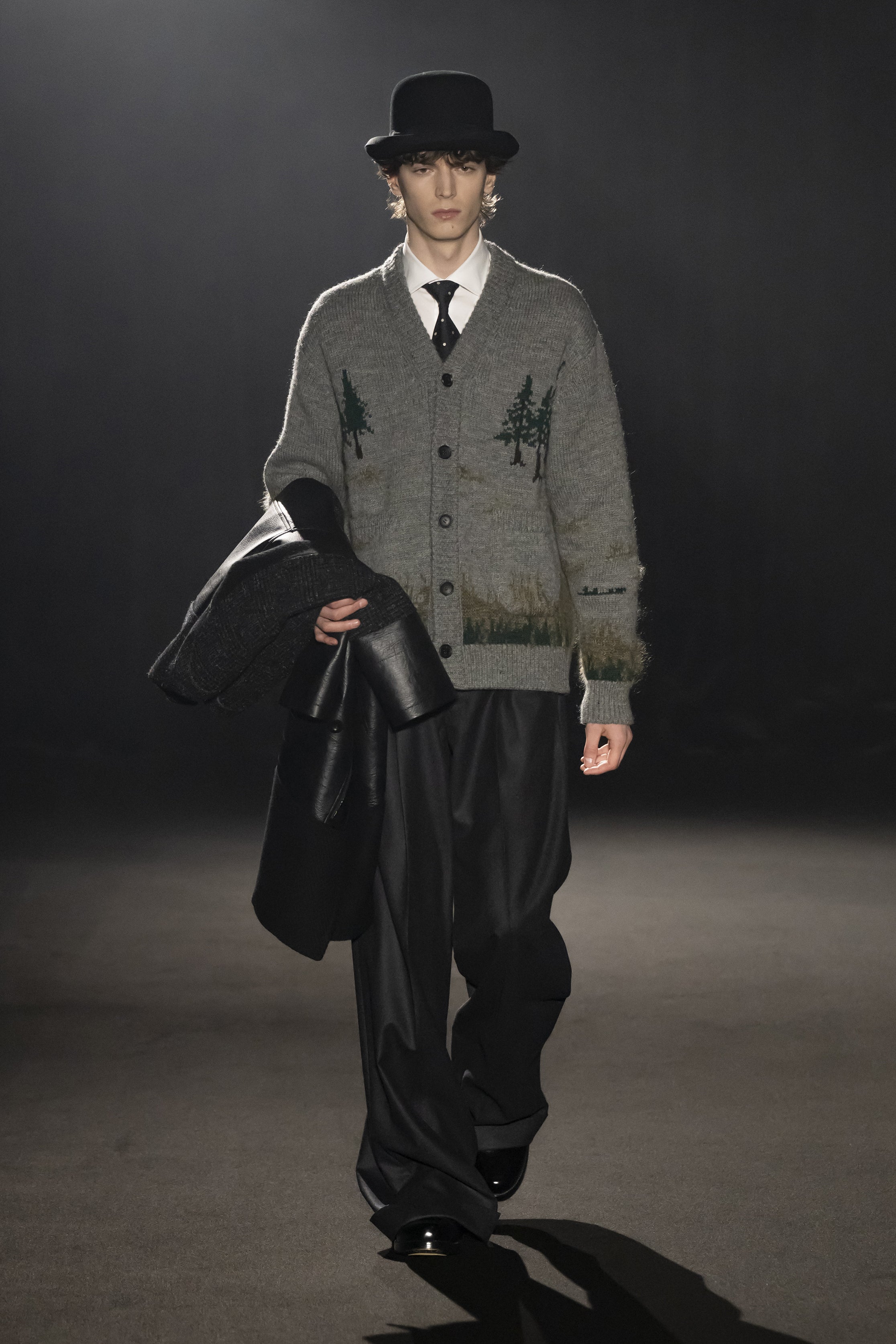 Fashion model wearing a JUNYA WATANABE MAN AW26 outfit