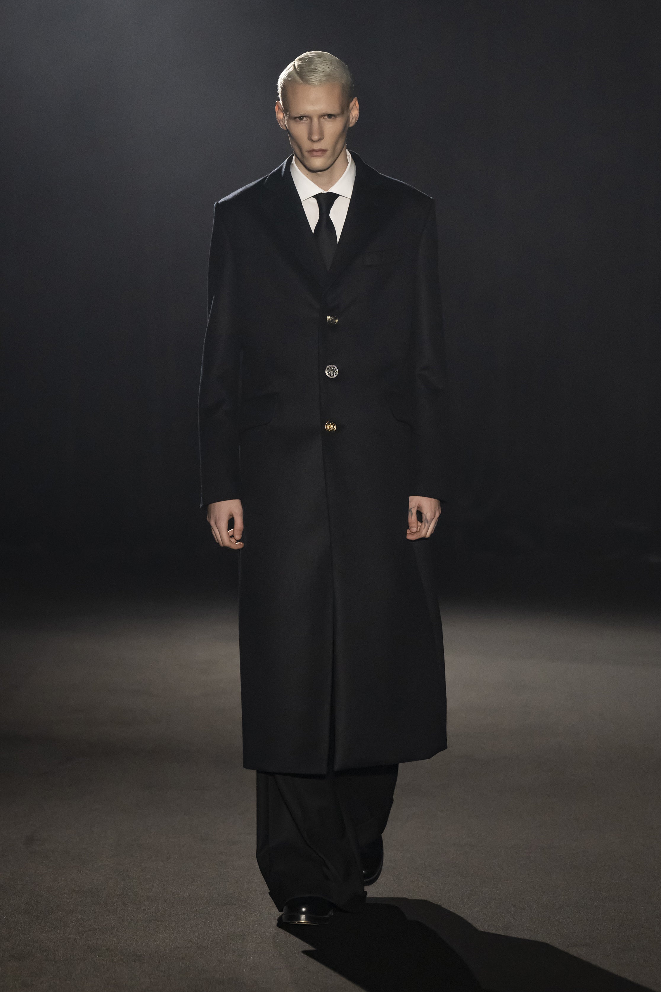 Fashion model wearing a JUNYA WATANABE MAN AW26 outfit
