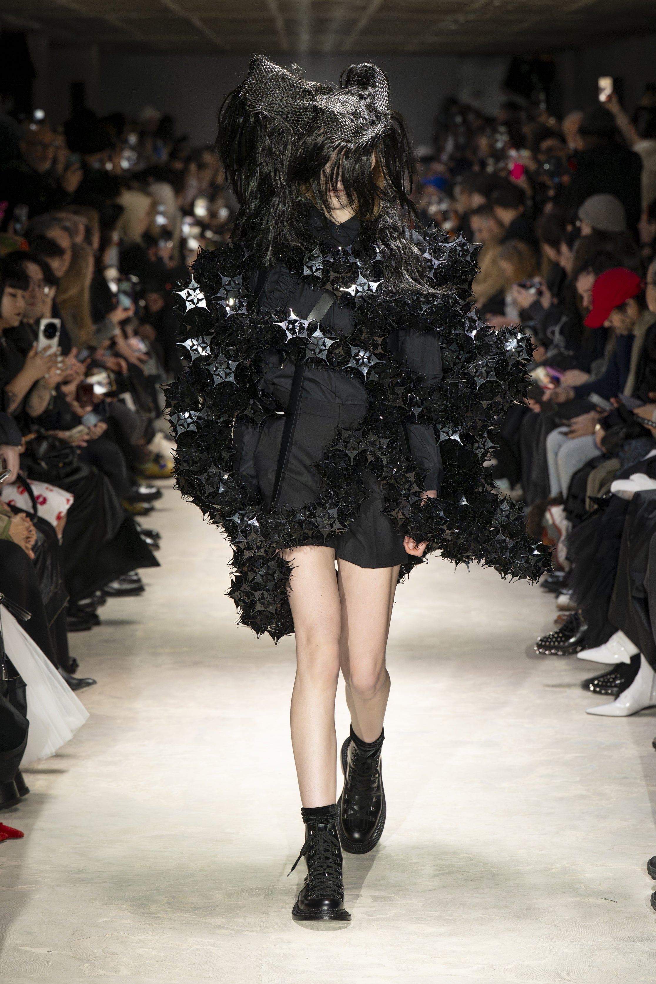 Fashion model wearing a NOIR KEI NINOMIYA AW26 outfit