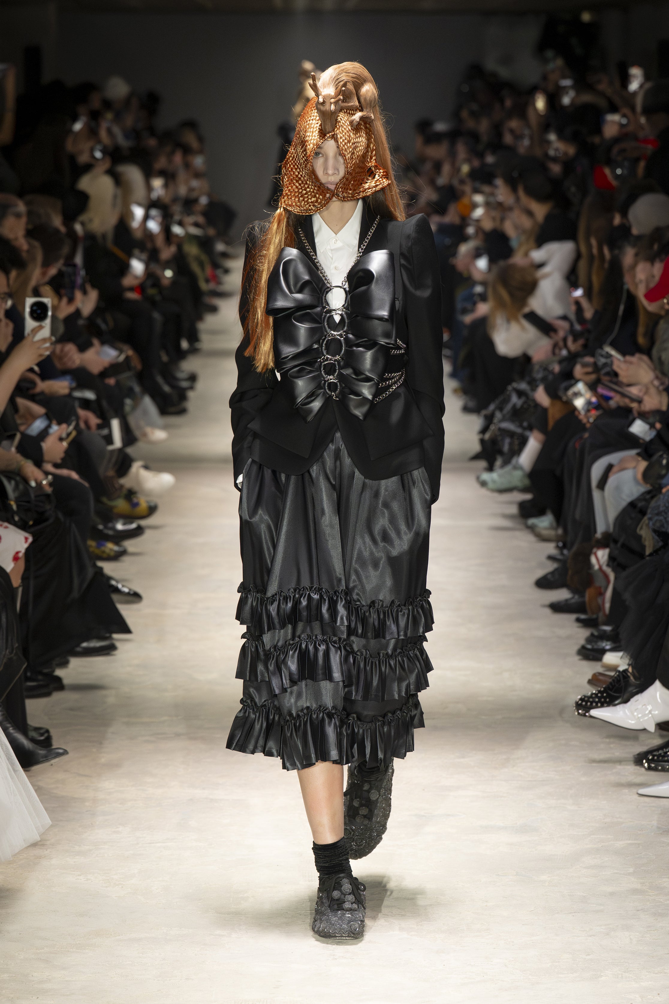 Fashion model wearing a NOIR KEI NINOMIYA AW26 outfit