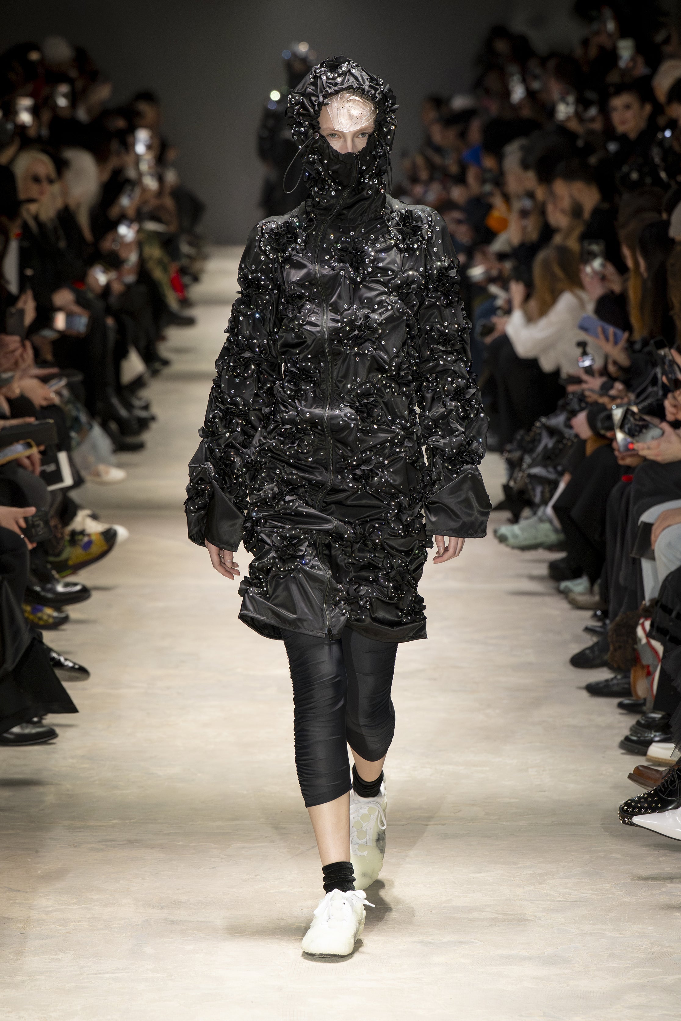 Fashion model wearing a NOIR KEI NINOMIYA AW26 outfit
