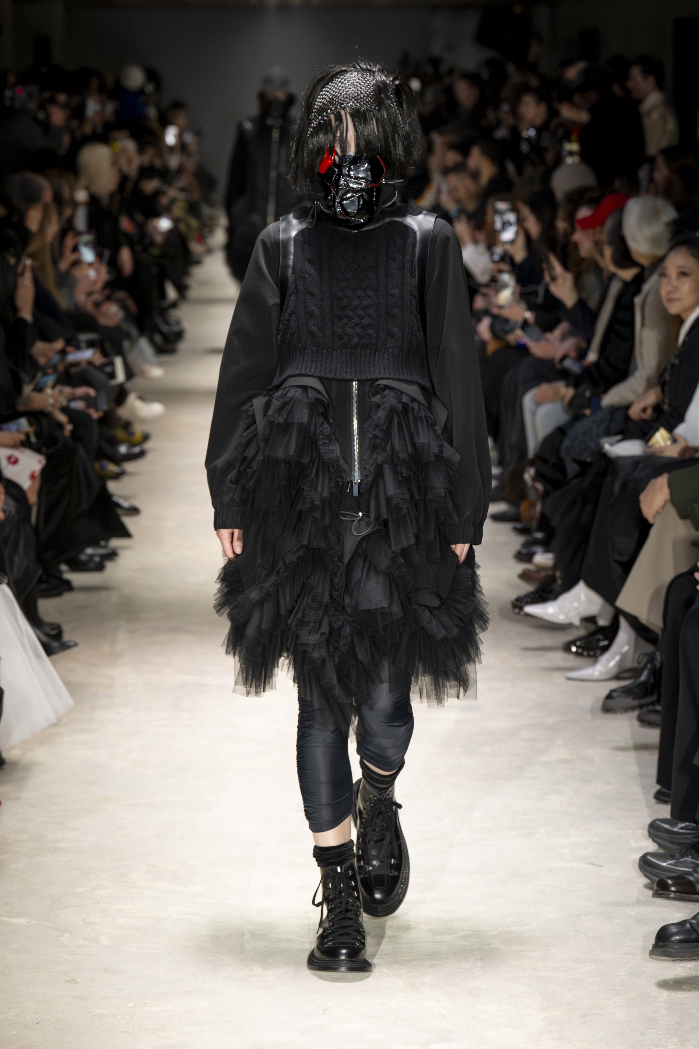Fashion model wearing a NOIR KEI NINOMIYA AW26 outfit