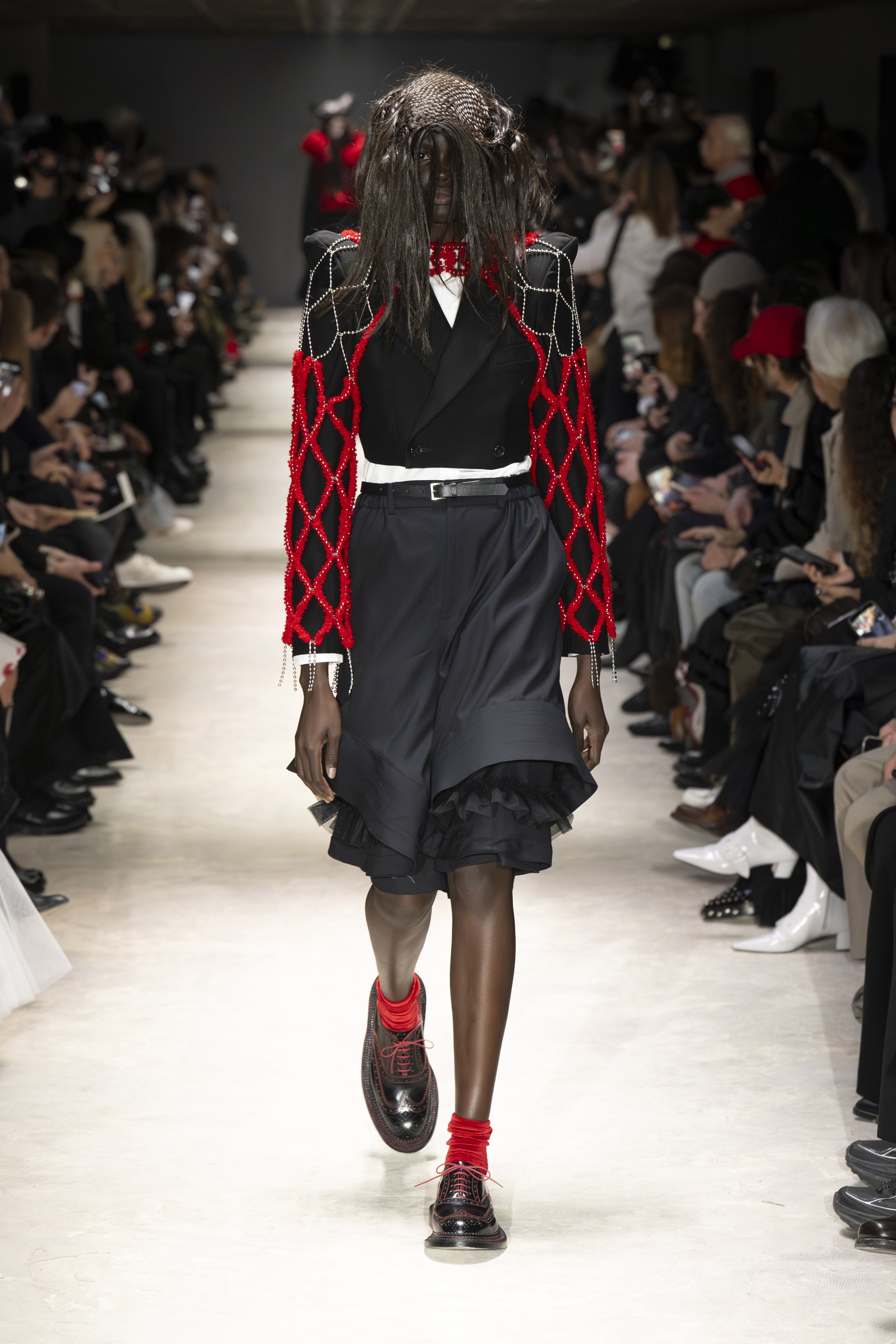Fashion model wearing a NOIR KEI NINOMIYA AW26 outfit