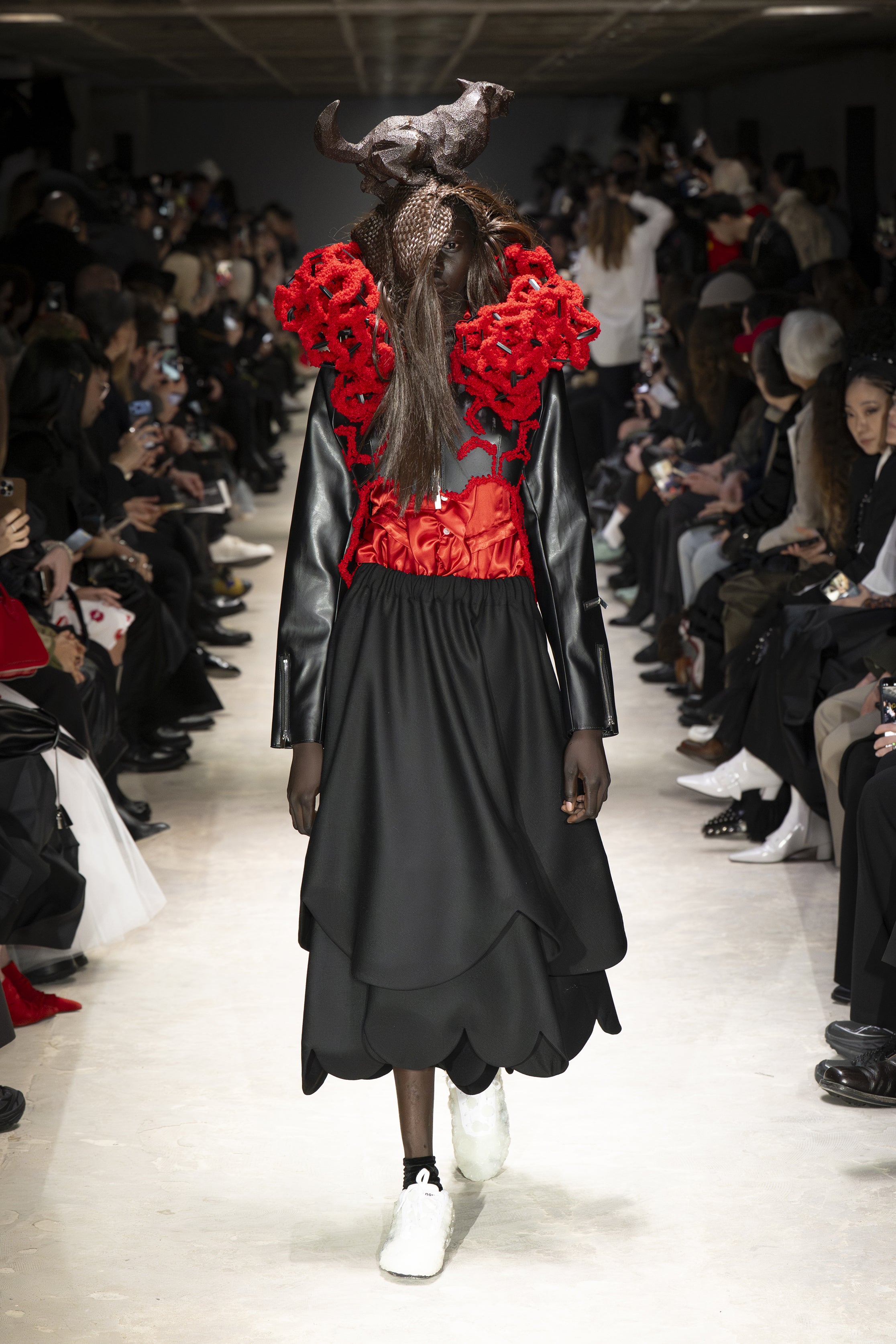 Fashion model wearing a NOIR KEI NINOMIYA AW26 outfit