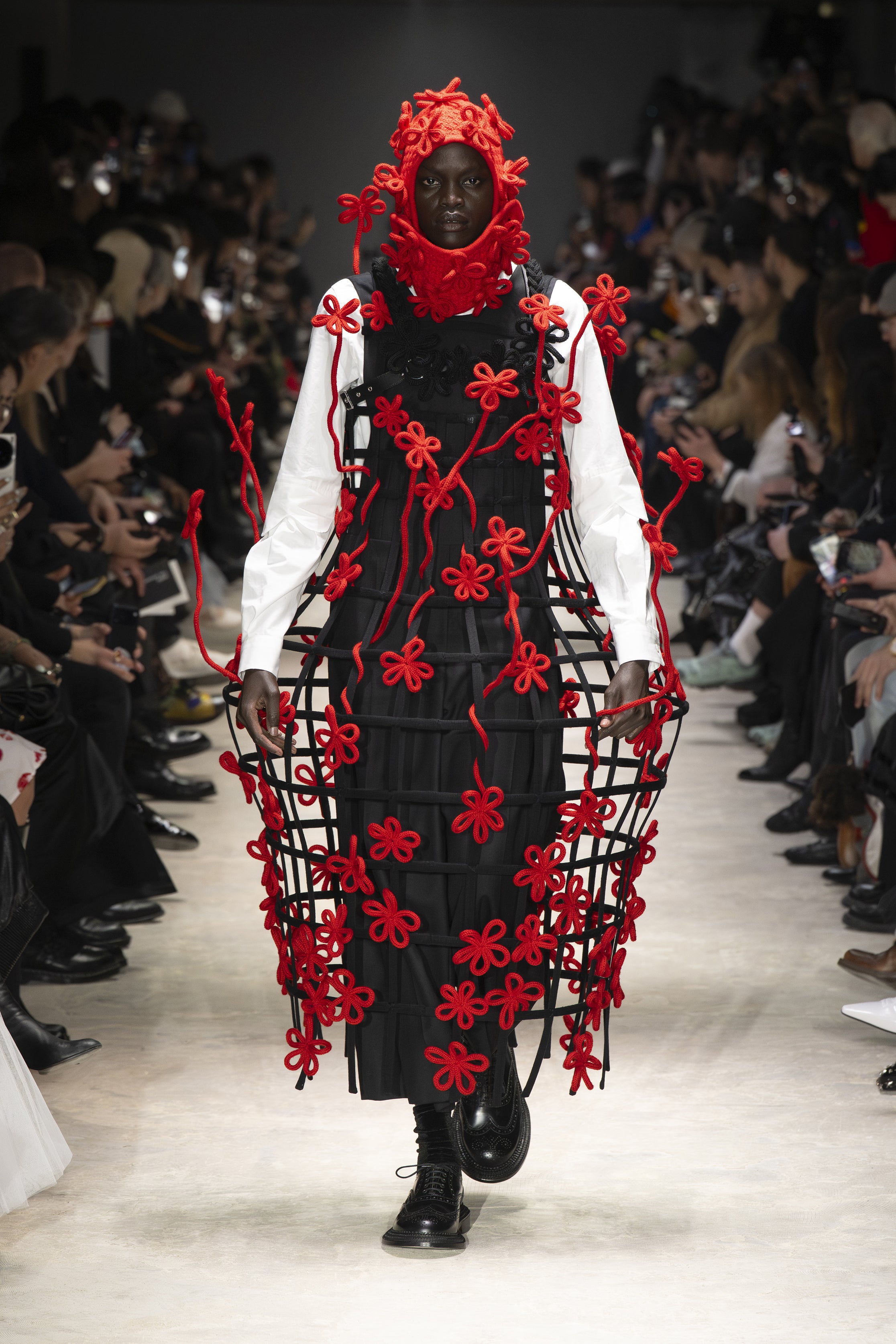 Fashion model wearing a NOIR KEI NINOMIYA AW26 outfit