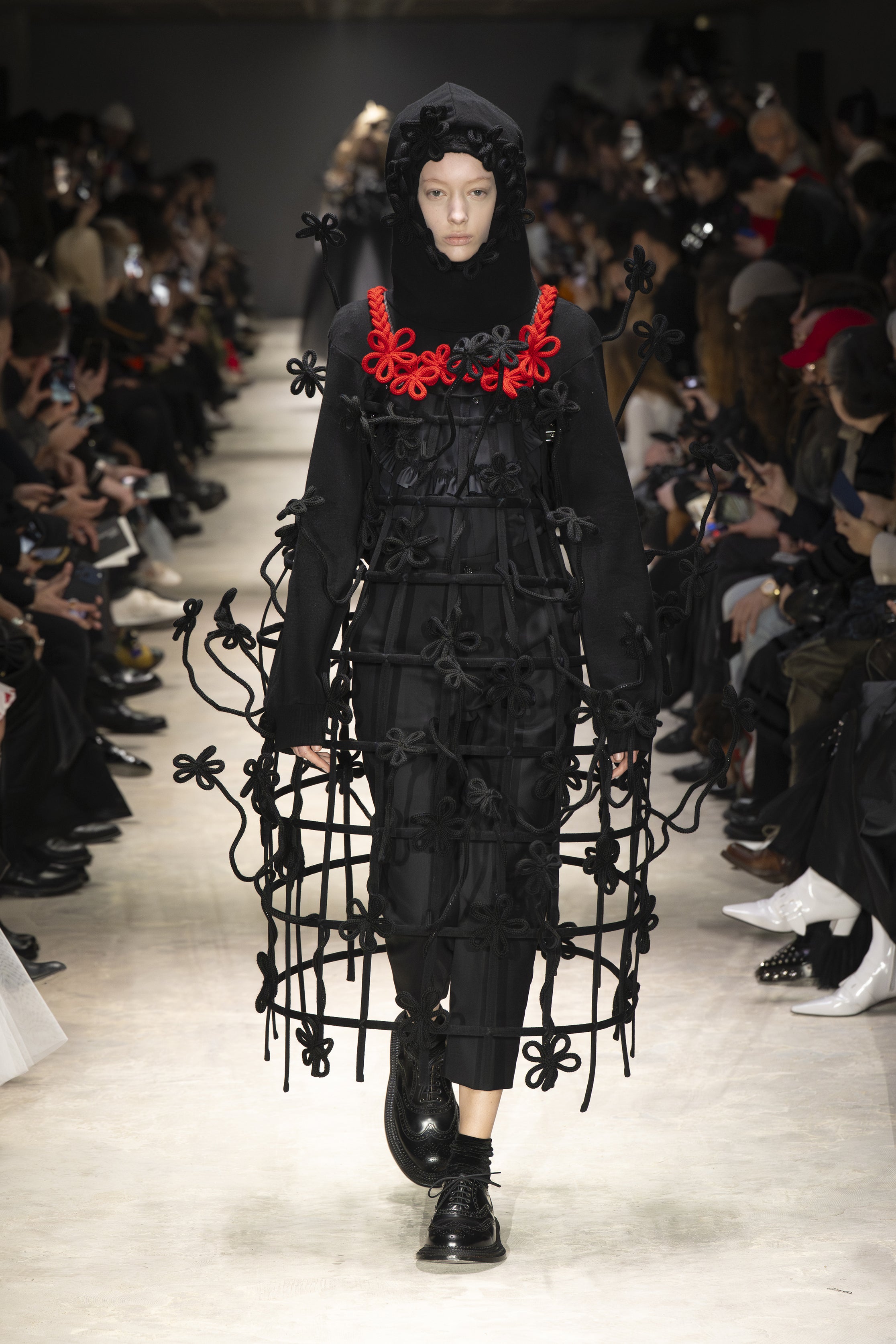Fashion model wearing a NOIR KEI NINOMIYA AW26 outfit