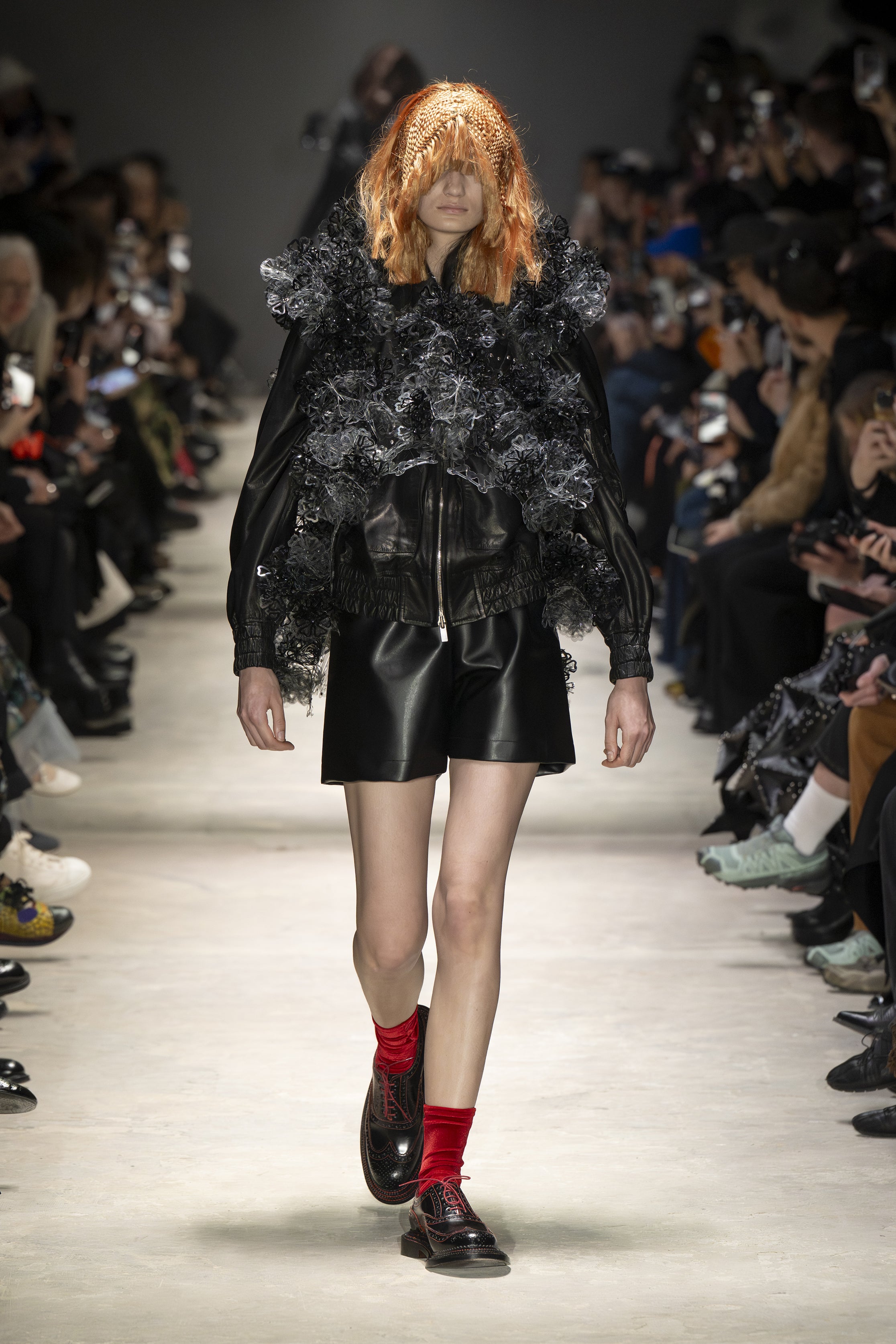 Fashion model wearing a NOIR KEI NINOMIYA AW26 outfit
